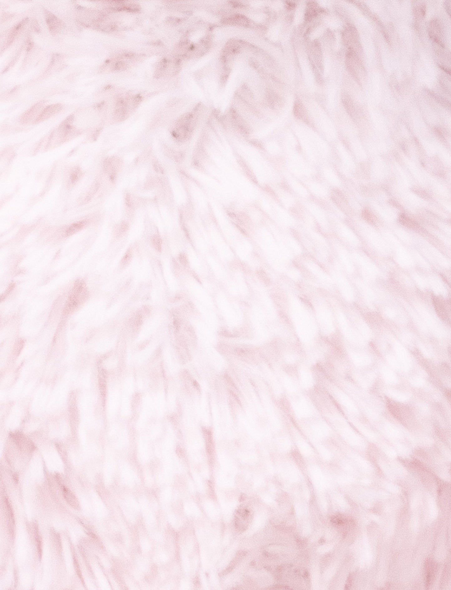 A soft pink plush bunny with floppy ears, a beige nose, and golden-stitched eyes