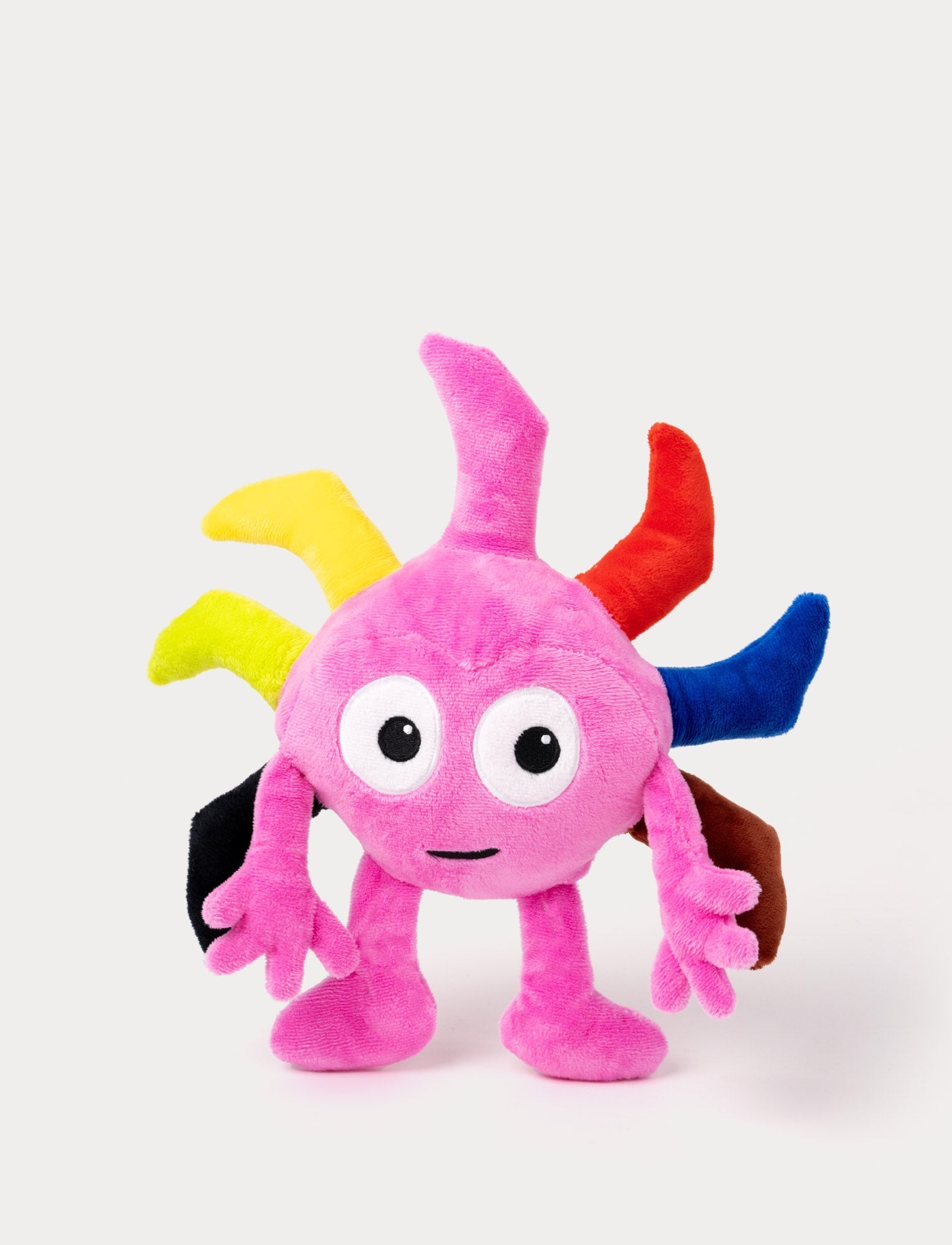  Image of Pink plush toy with large eyes, multiple colorful spikes on its head, and arms with playful fingers.