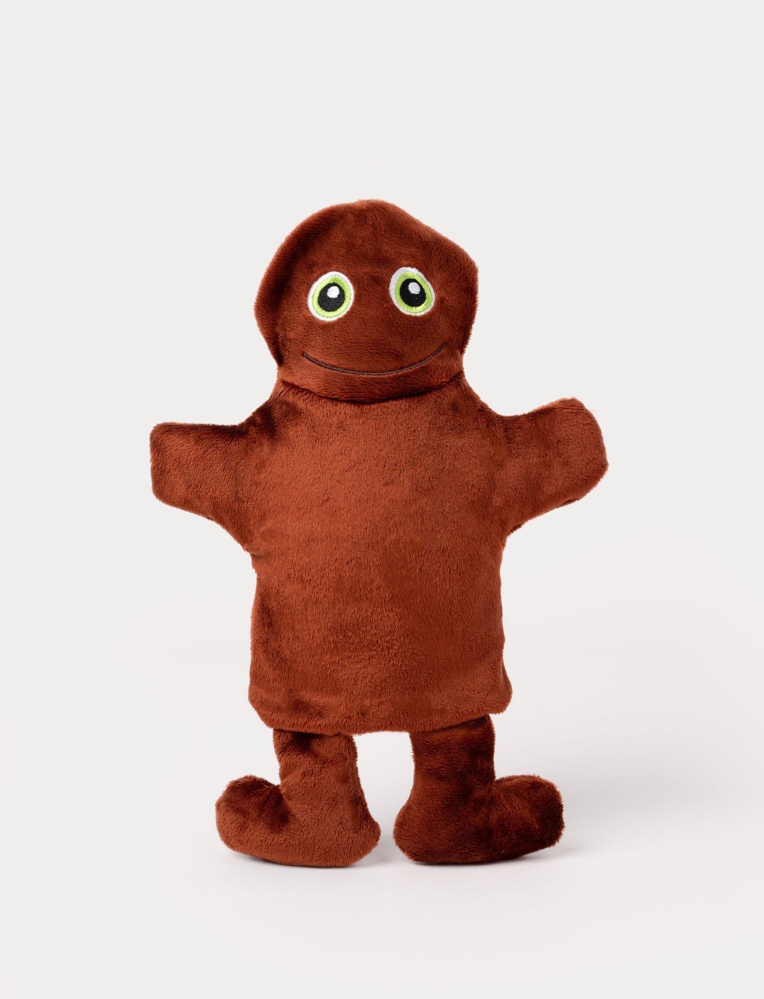  Image of Brown hand puppet with a rounded head, big green eyes, outstretched arms, and a friendly embroidered smile.