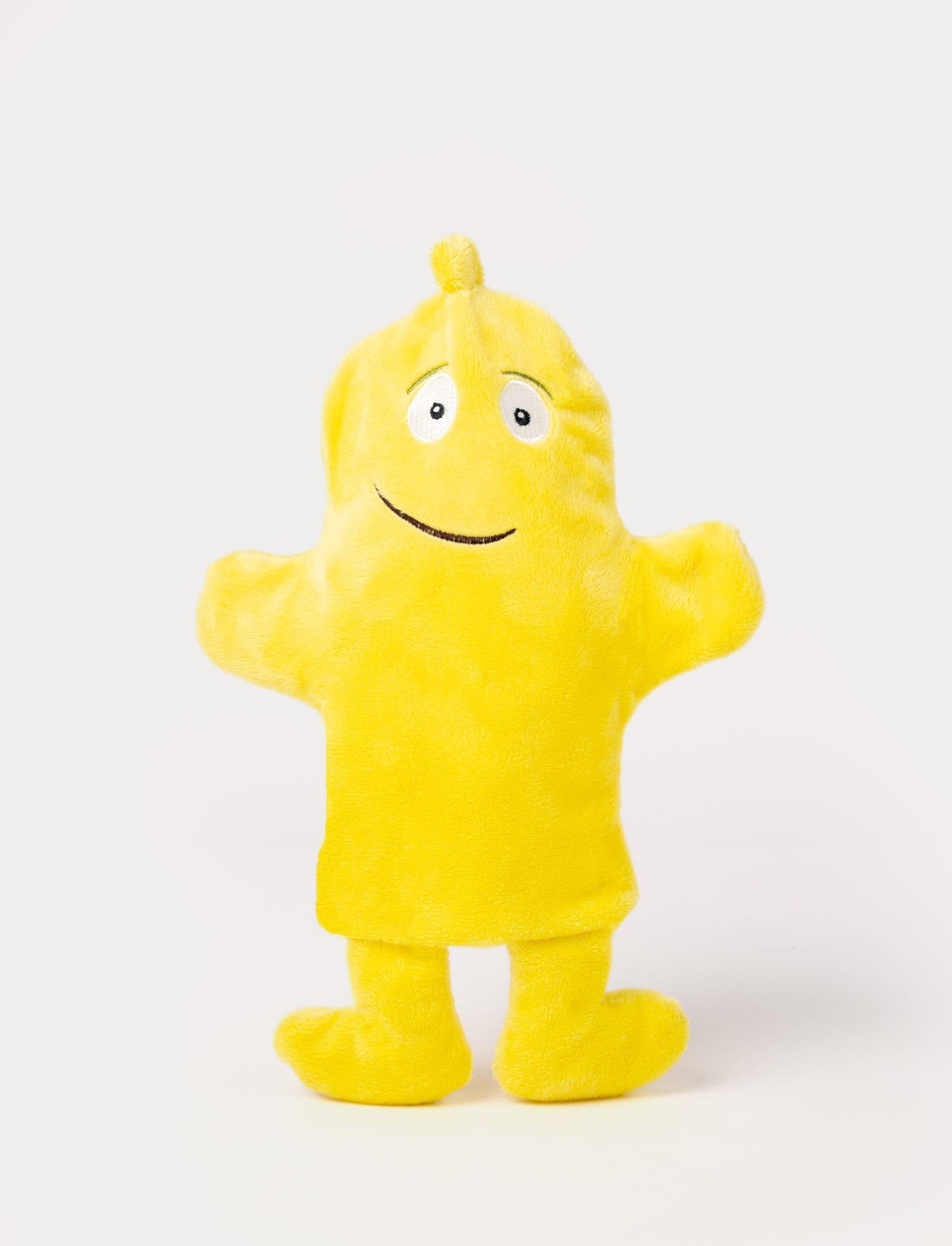  Image of Yellow hand puppet with a rounded body, small tuft on top, outstretched arms, and a friendly embroidered smile.