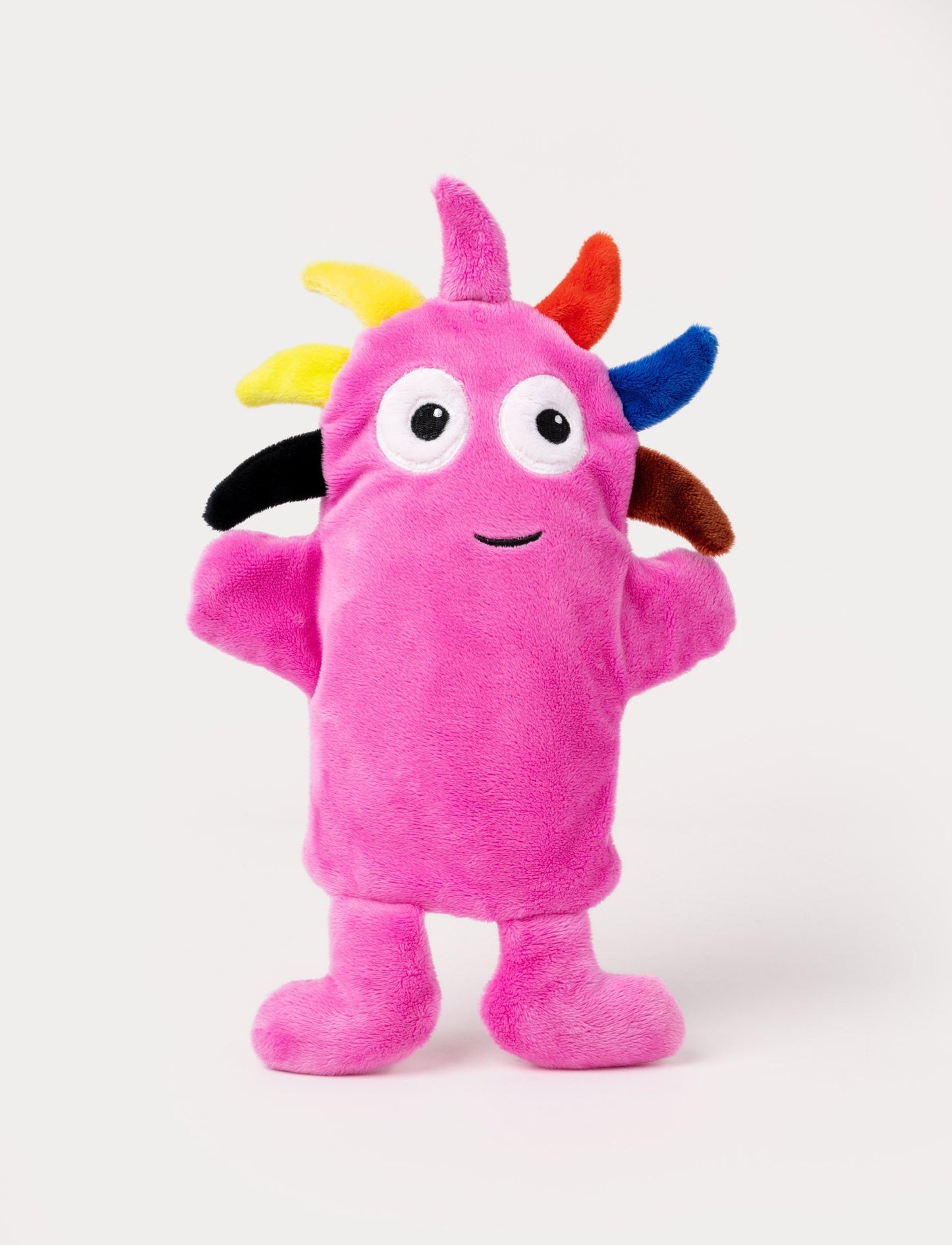 Pink hand puppet with large eyes, a cheerful smile, and colorful spikes on its head.