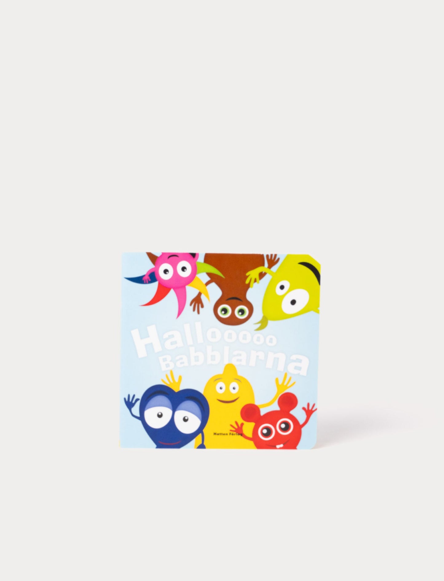 Open children's book featuring a red Babblarna characters 