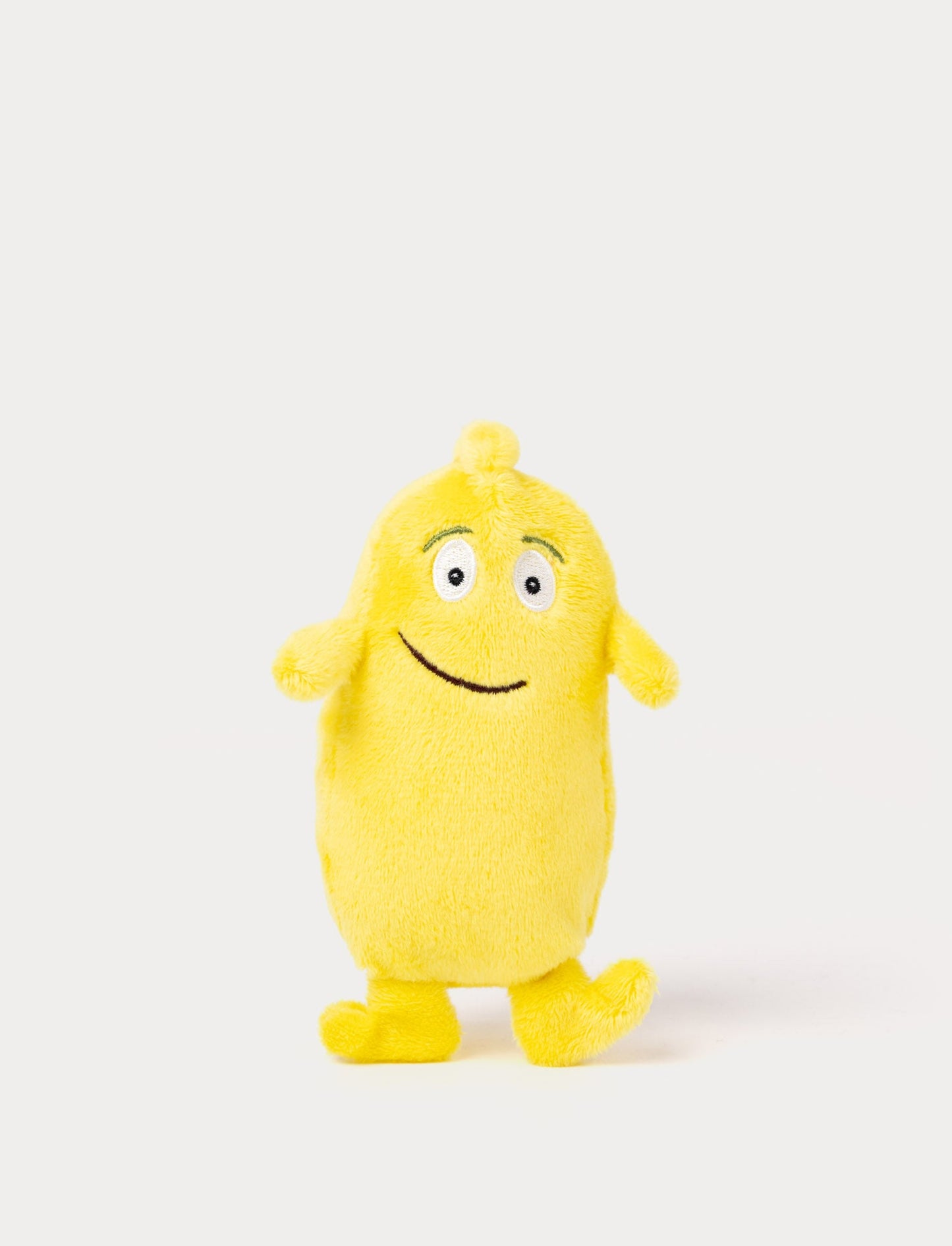 A yellow plush Bibbi with a friendly smile and very small and oblong deisgn  