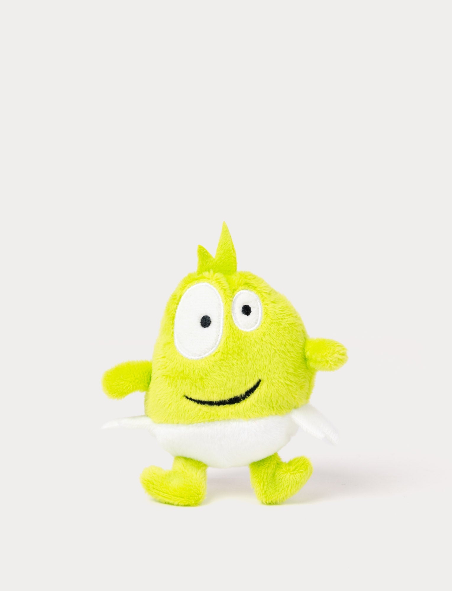  Image of A green plush Dadda with a friendly smile and very small deisgn  