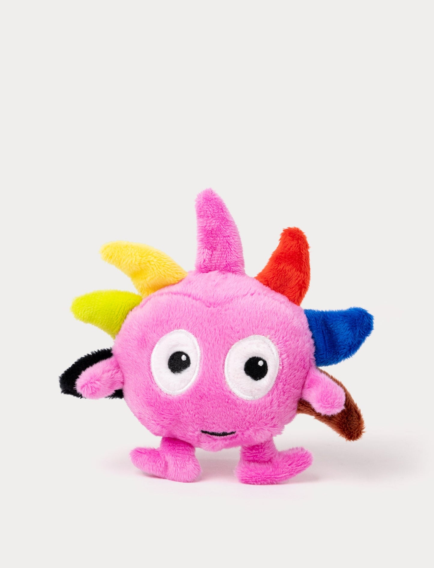 A green plush Dadda with colorful spikes on top of the head and a very small deisgn  