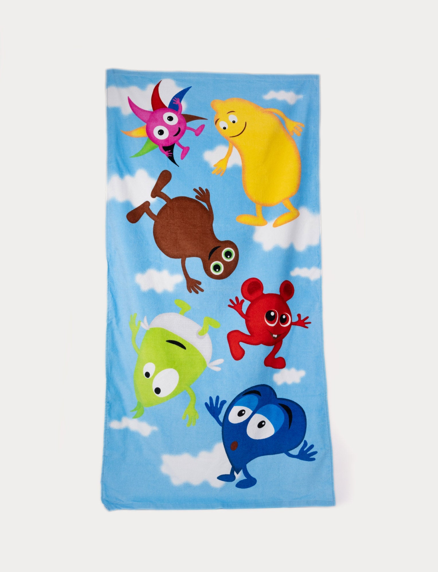 Image of Babblarna bath towel with colorful characters on a blue sky background.