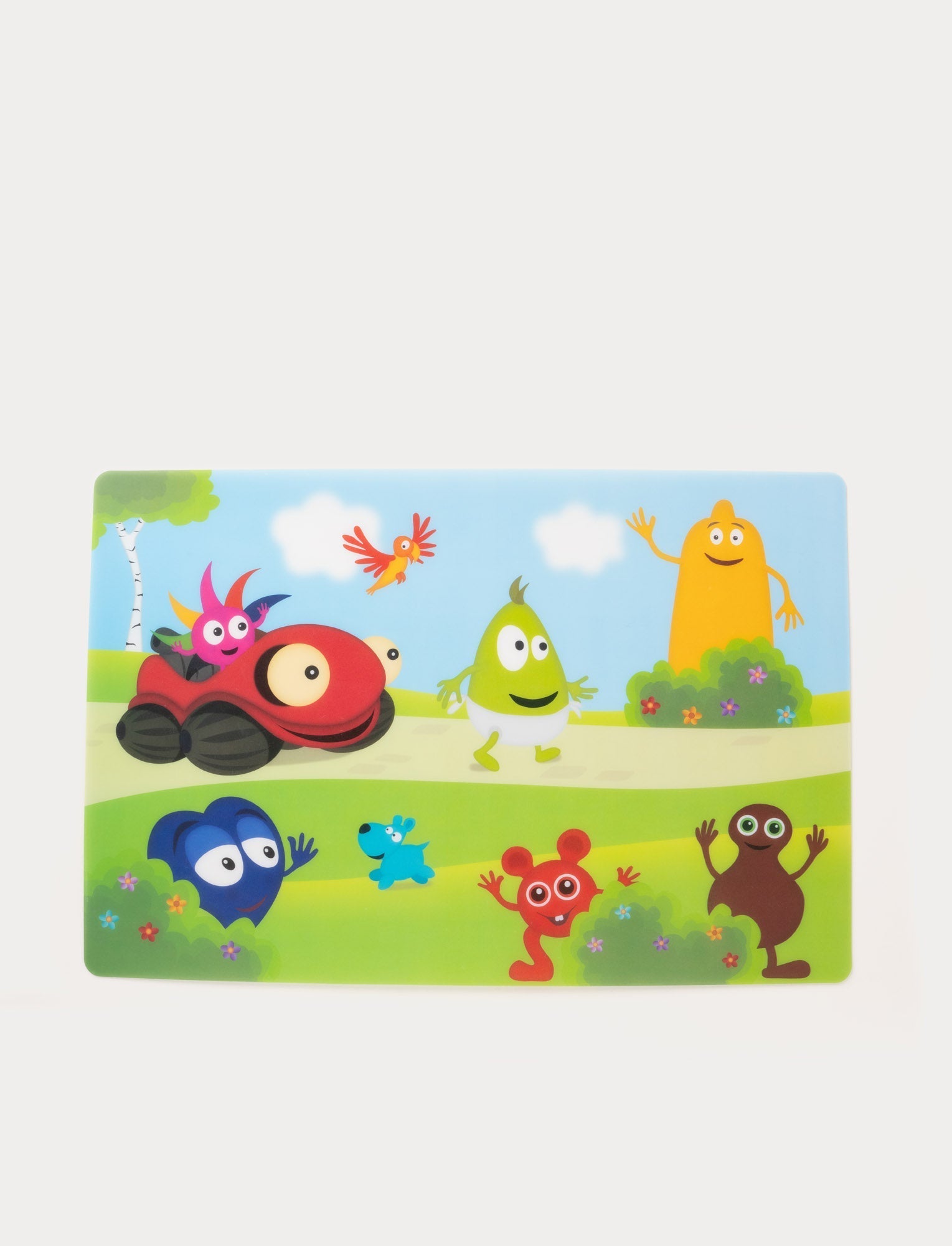  Image of Colorful children's placemat featuring Babblarna characters in a cheerful outdoor scene with trees and clouds.