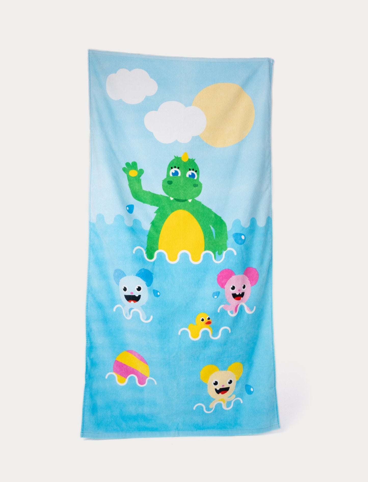 Bolibompa beach towel with a green dragon and colorful characters in the water.