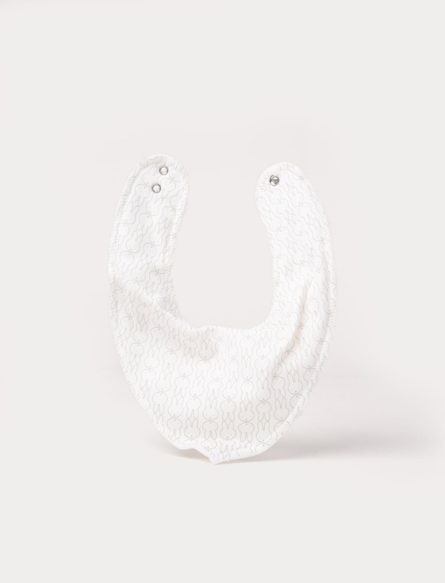 Soft, white, double-layered cotton Miffy dribble bib with adjustable snap buttons 