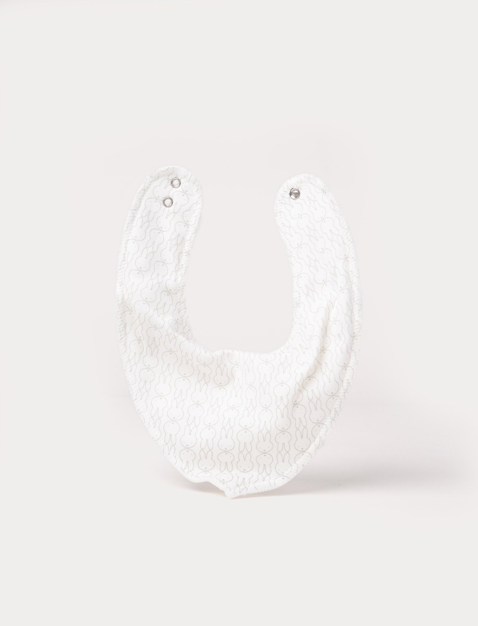  Image of Soft, white, double-layered cotton Miffy dribble bib with adjustable snap buttons 