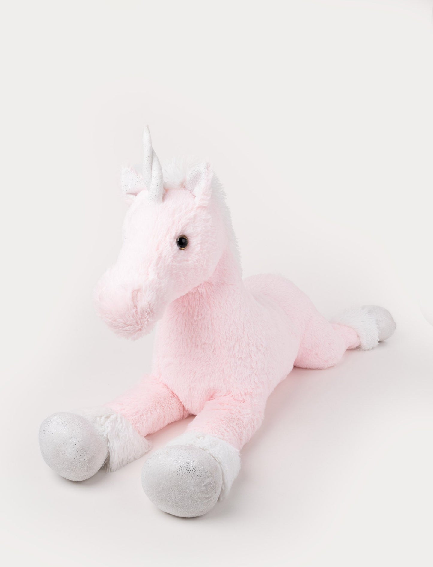 Soft pink plush unicorn with silver hooves, a white mane, and a shimmering silver horn.
