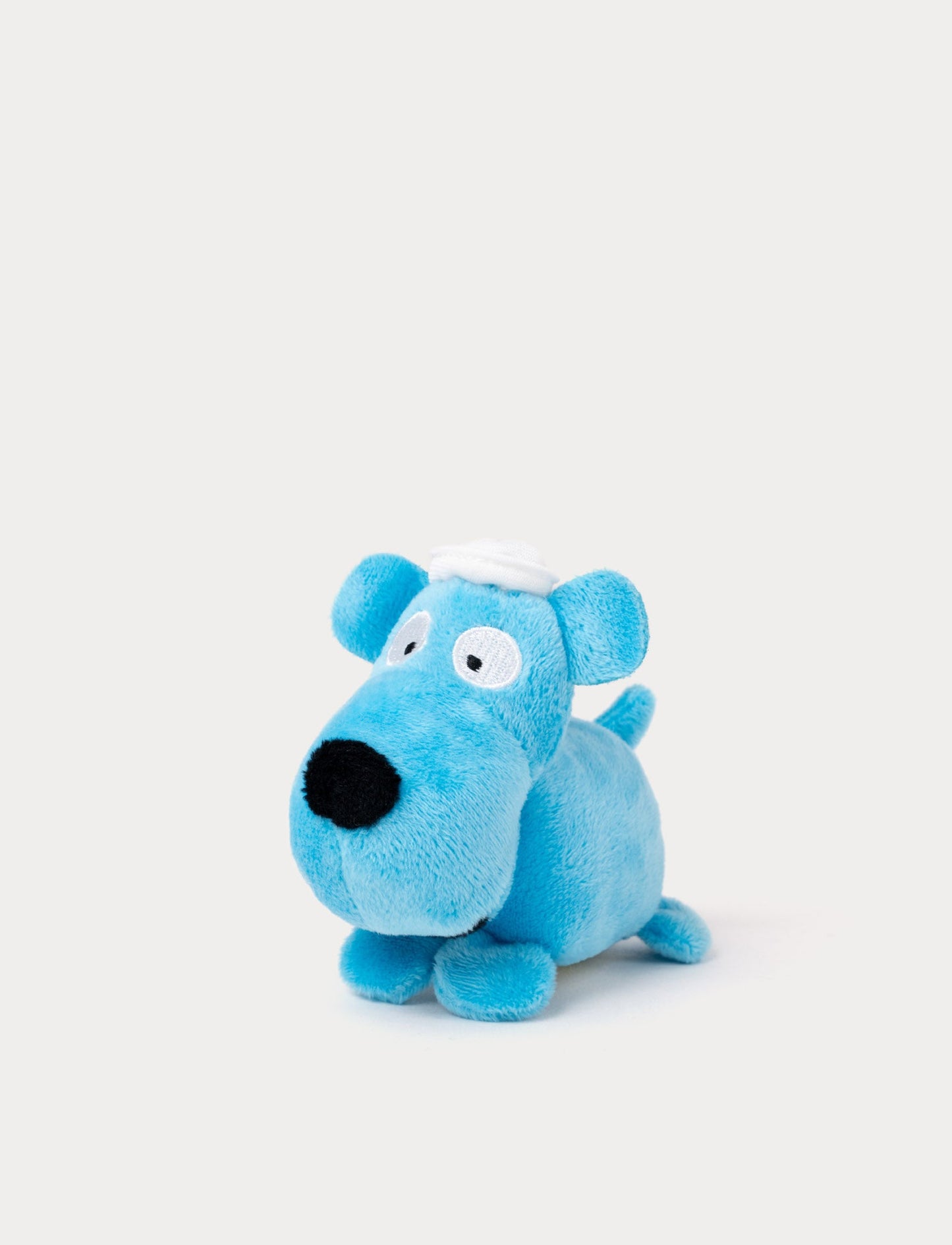Small, blue and soft Vovvo plush dog with a playful expressionwith a very small design 