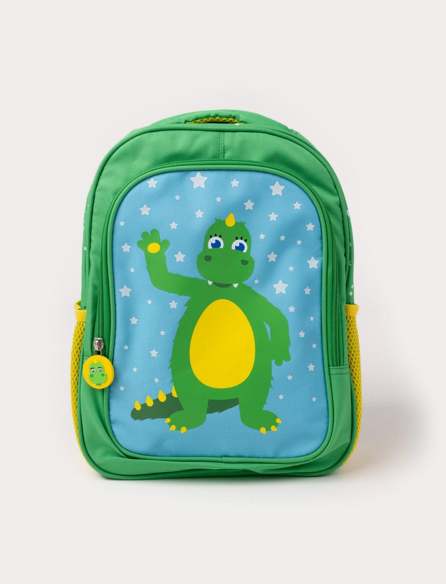 A green children's backpack featuring the Bolibompa dragon on a blue starry background, with yellow side pockets.