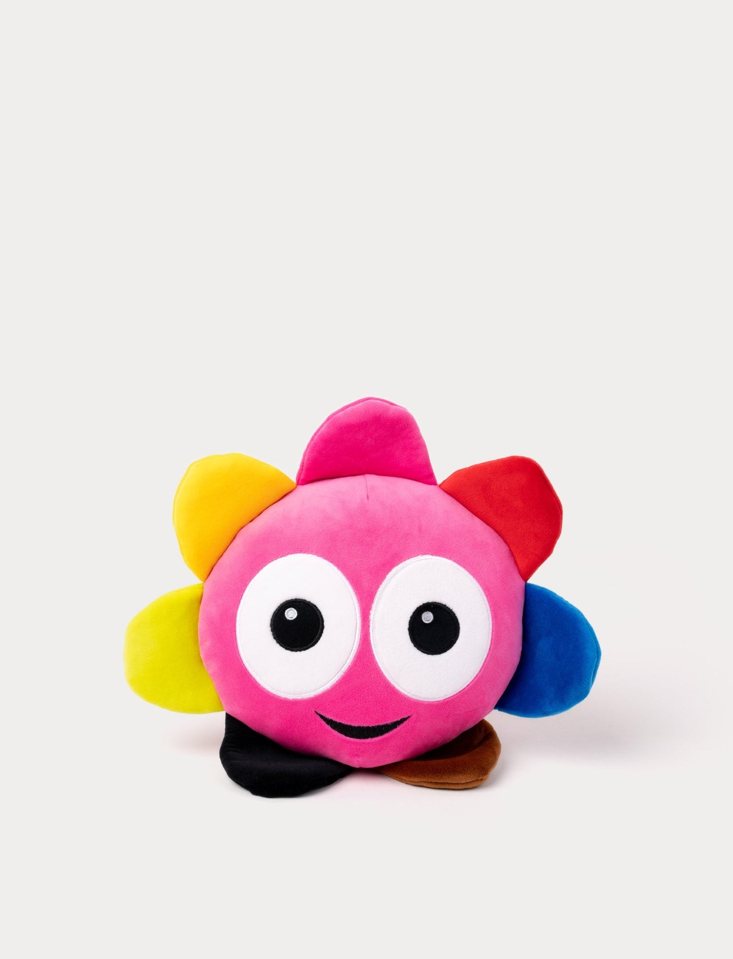 Pink plush toy with large round eyes, a cheerful smile, and colorful petals.