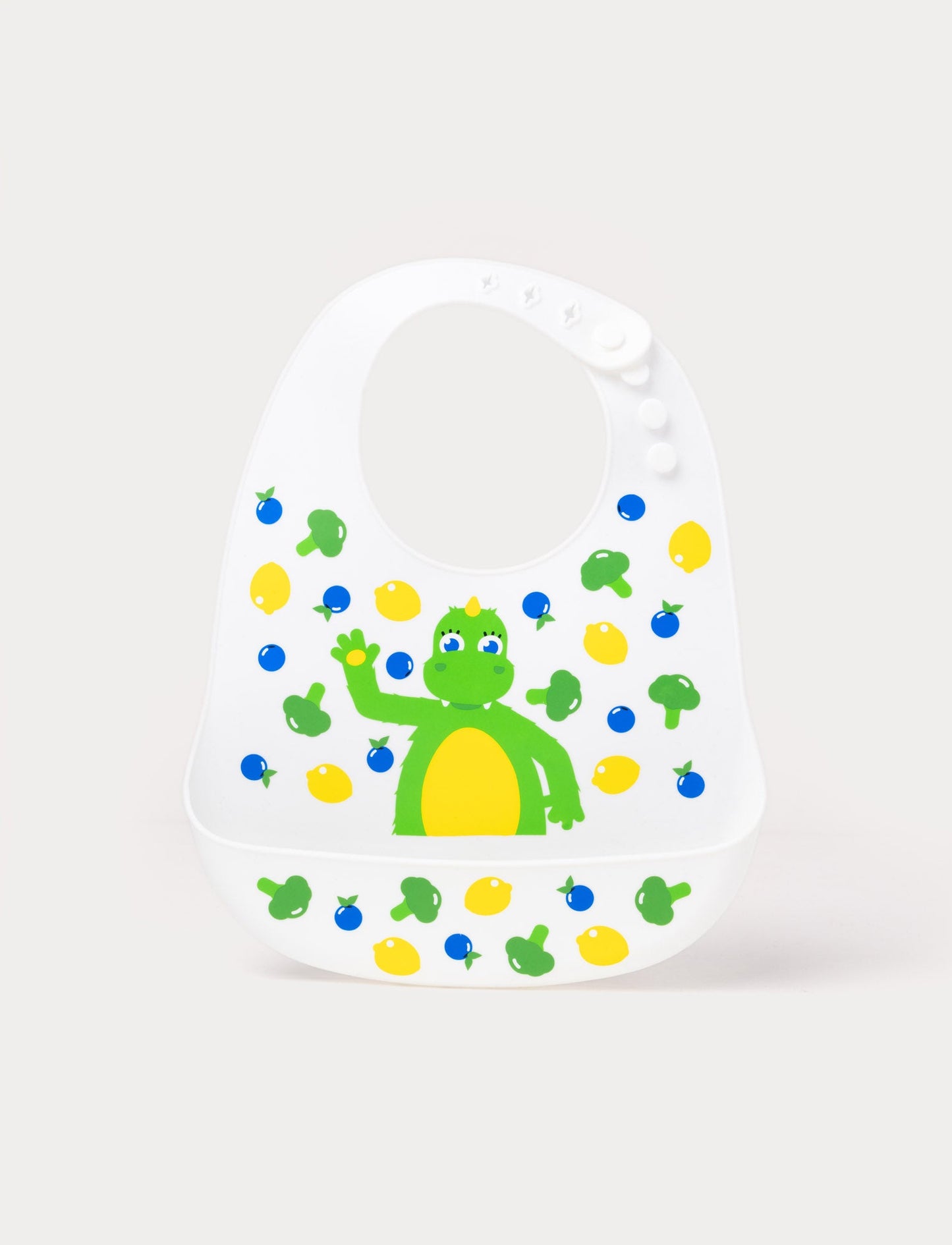 Soft silicone bib in pastel colors with a cute Bolibompa design, featuring an adjustable closure and deep spill pocket.