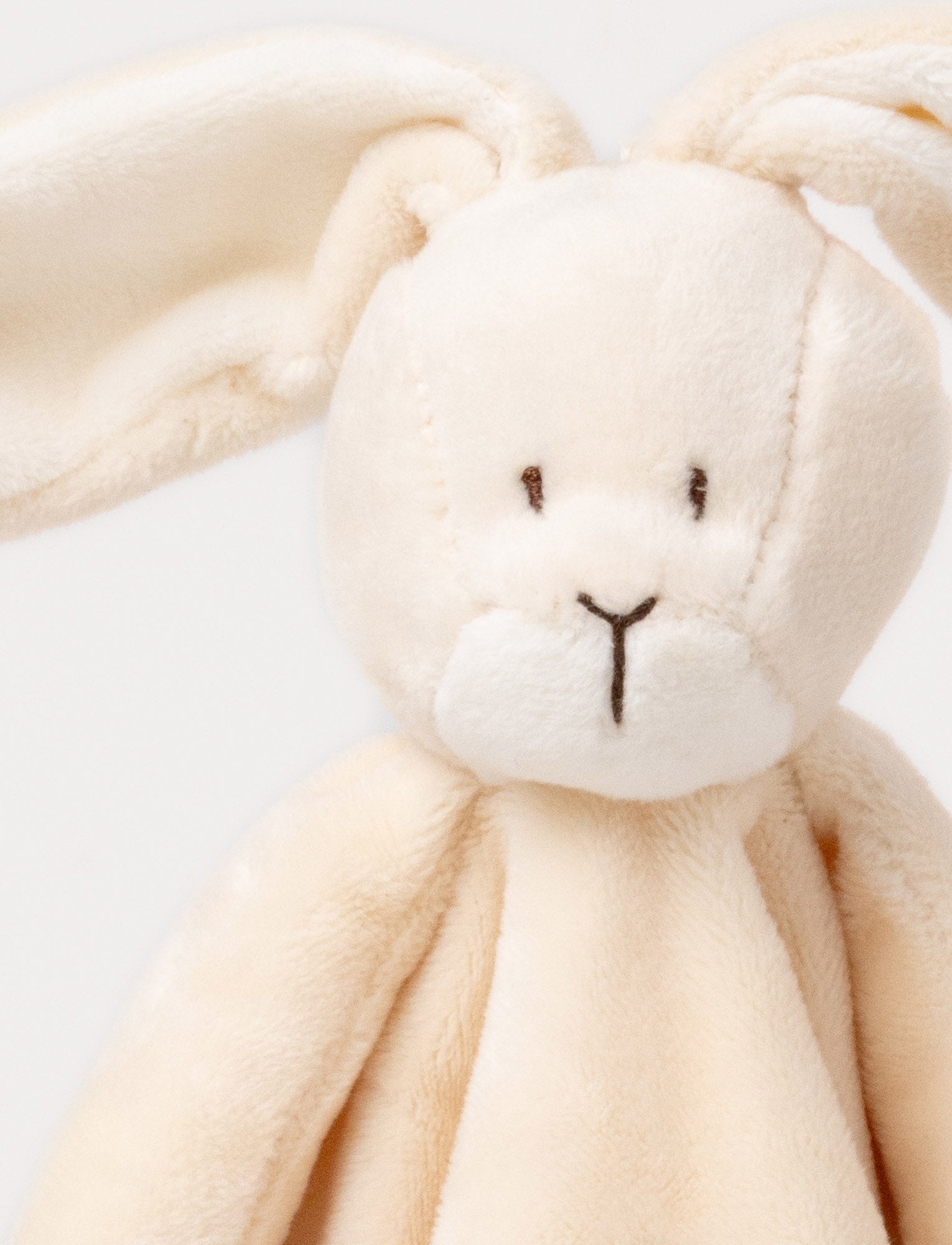 Image of A beige-brown baby blanket with a soft plush bunny, white contrast details