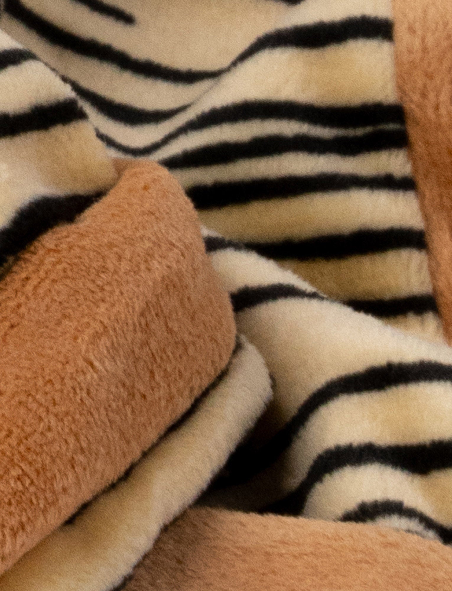  Image of A soft tiger-shaped baby blanket with beige and brown details
