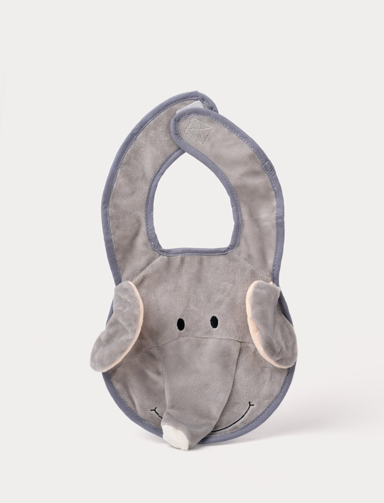  Image of A grey elephant-shaped baby bib with floppy ears, a soft trunk, and a stitched smiling face.