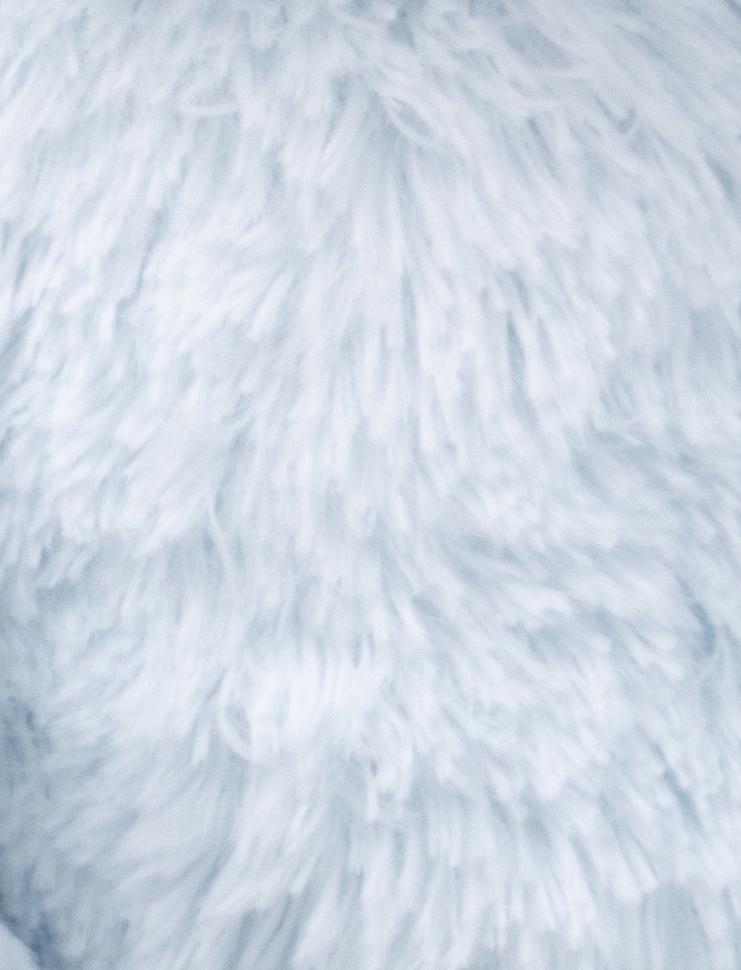  Image of A soft blue plush bunny with floppy ears, a beige nose, and golden-stitched eyes.