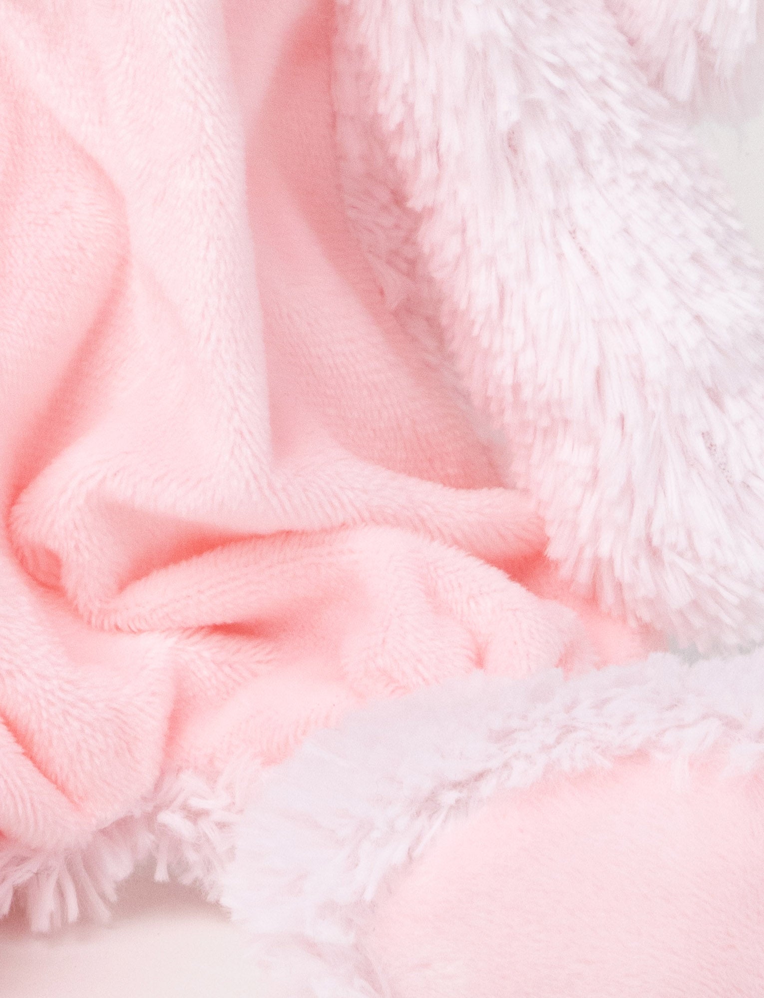  Image of Soft plush bunny with a pink fabric body, floppy furry ears, and fluffy paws.