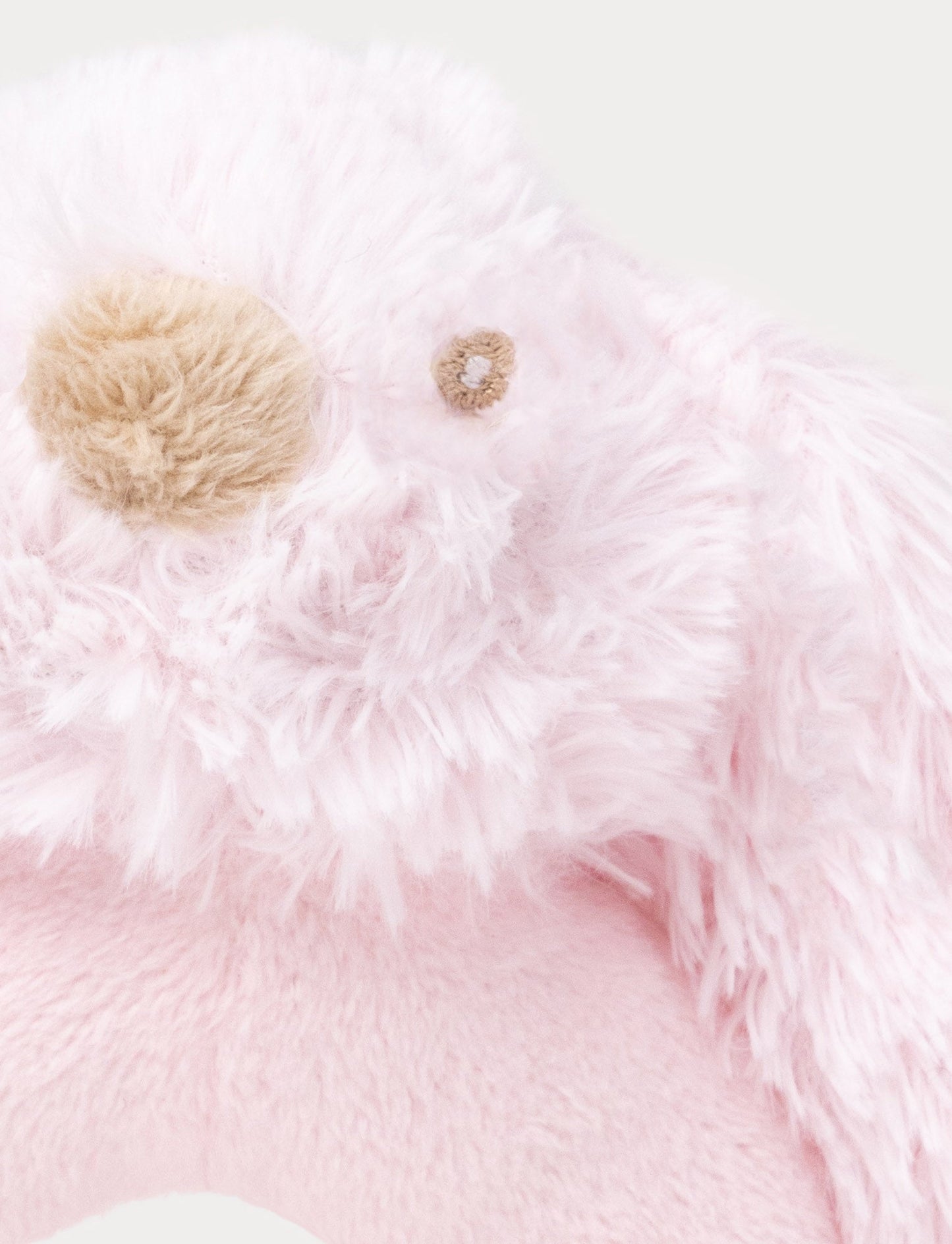 Soft pink baby rattle with a plush bunny head and floppy furry ears.