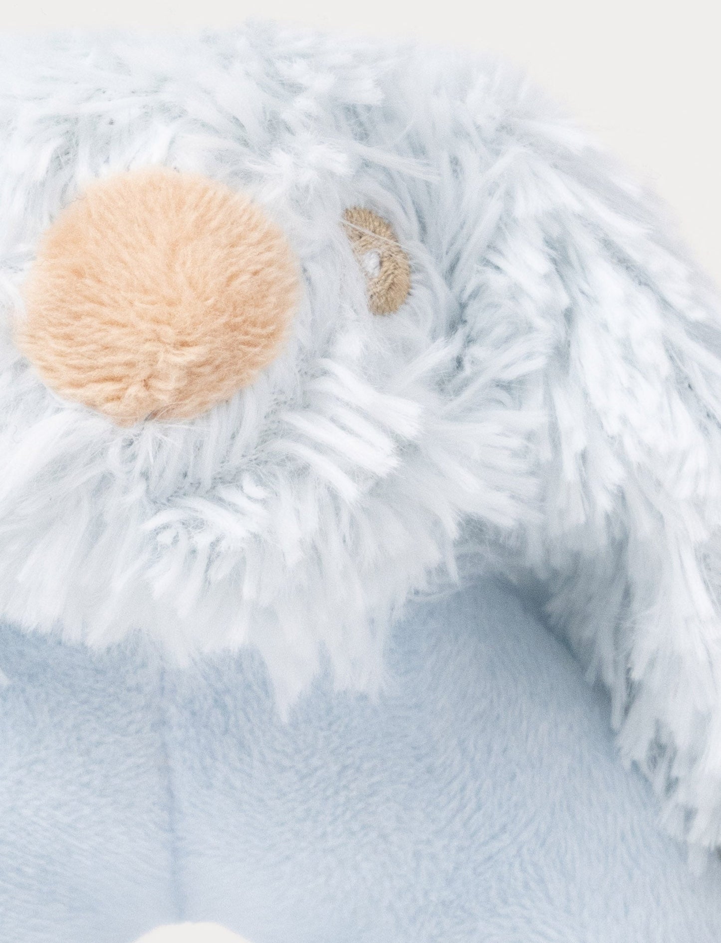 Soft blue baby rattle with a plush bunny head and floppy furry ears.