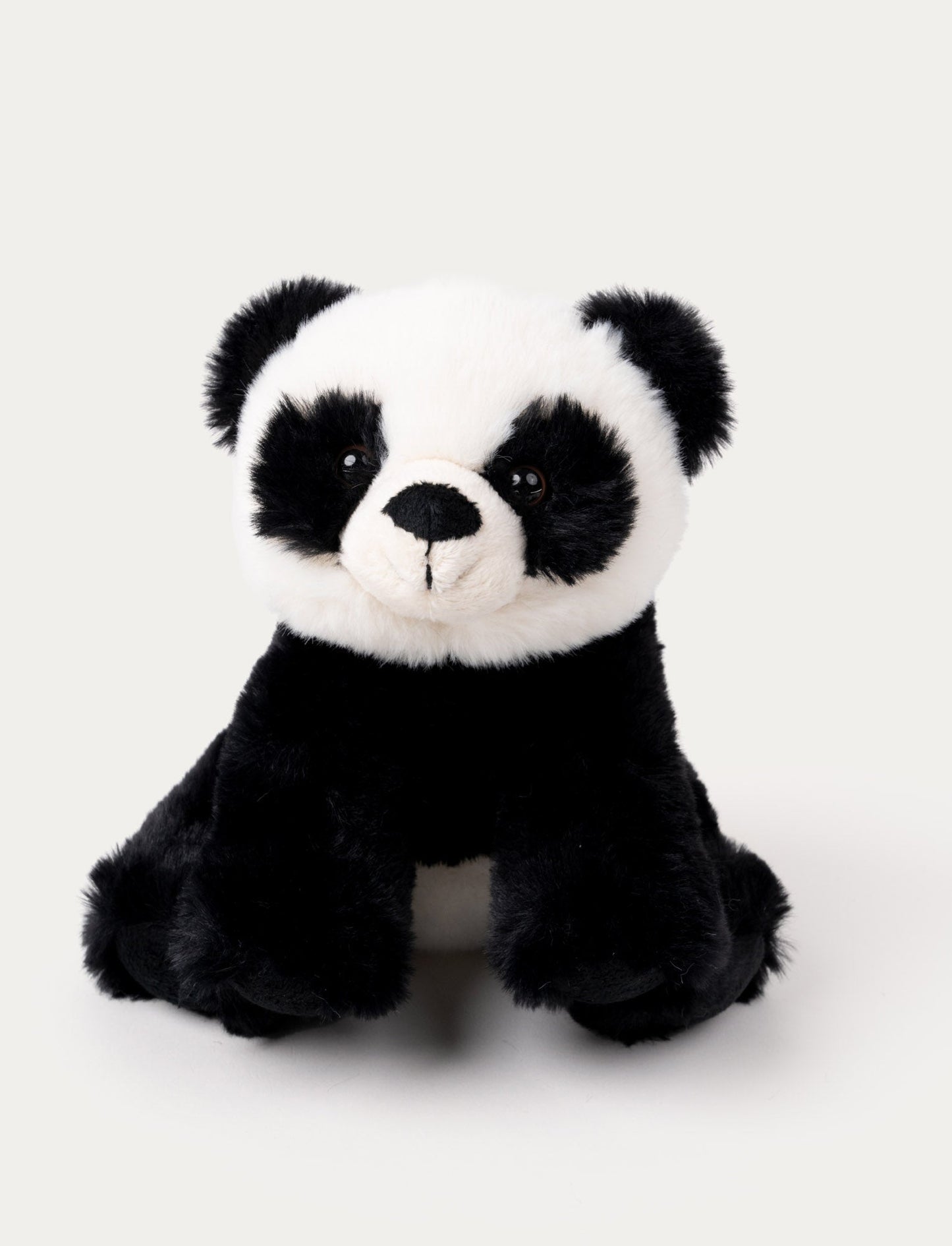 A cuddly panda with soft black-and-white fur, an adorable nose, and lively plastic eyes.