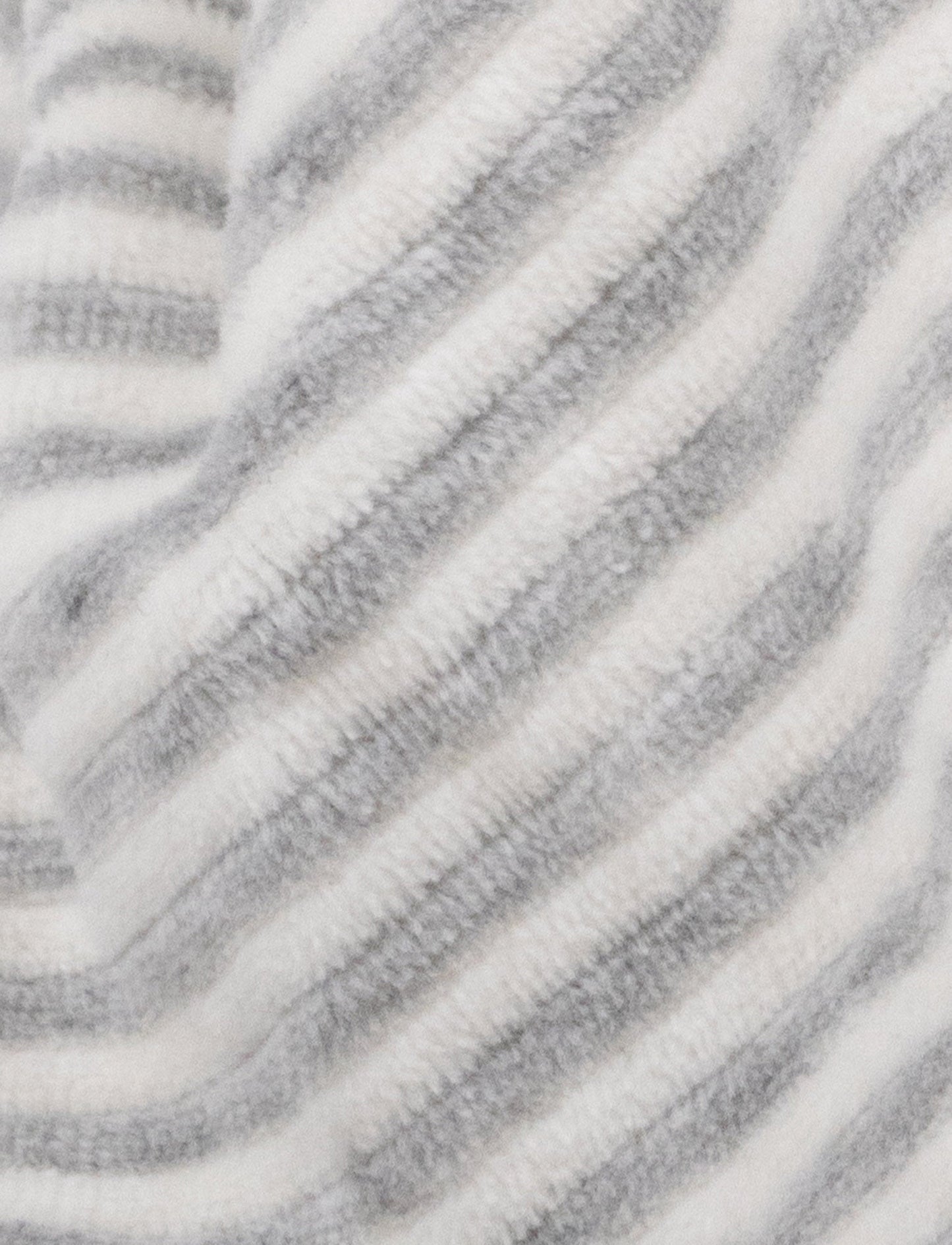 A grey and white striped plush bunny comforter with floppy ears and knotted fabric ends.