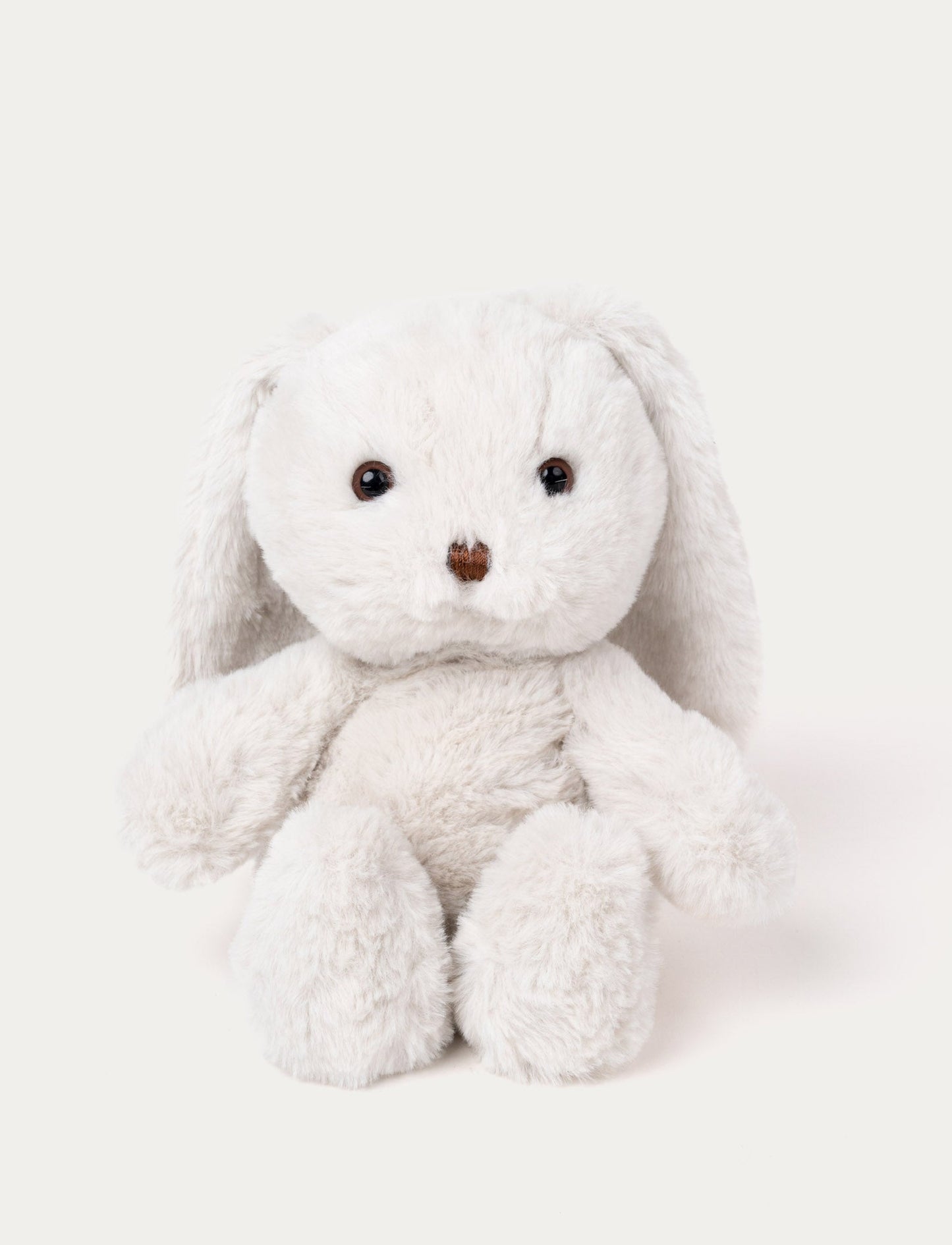 Soft white plush bunny with long floppy ears, brown eyes, and a stitched brown nose.