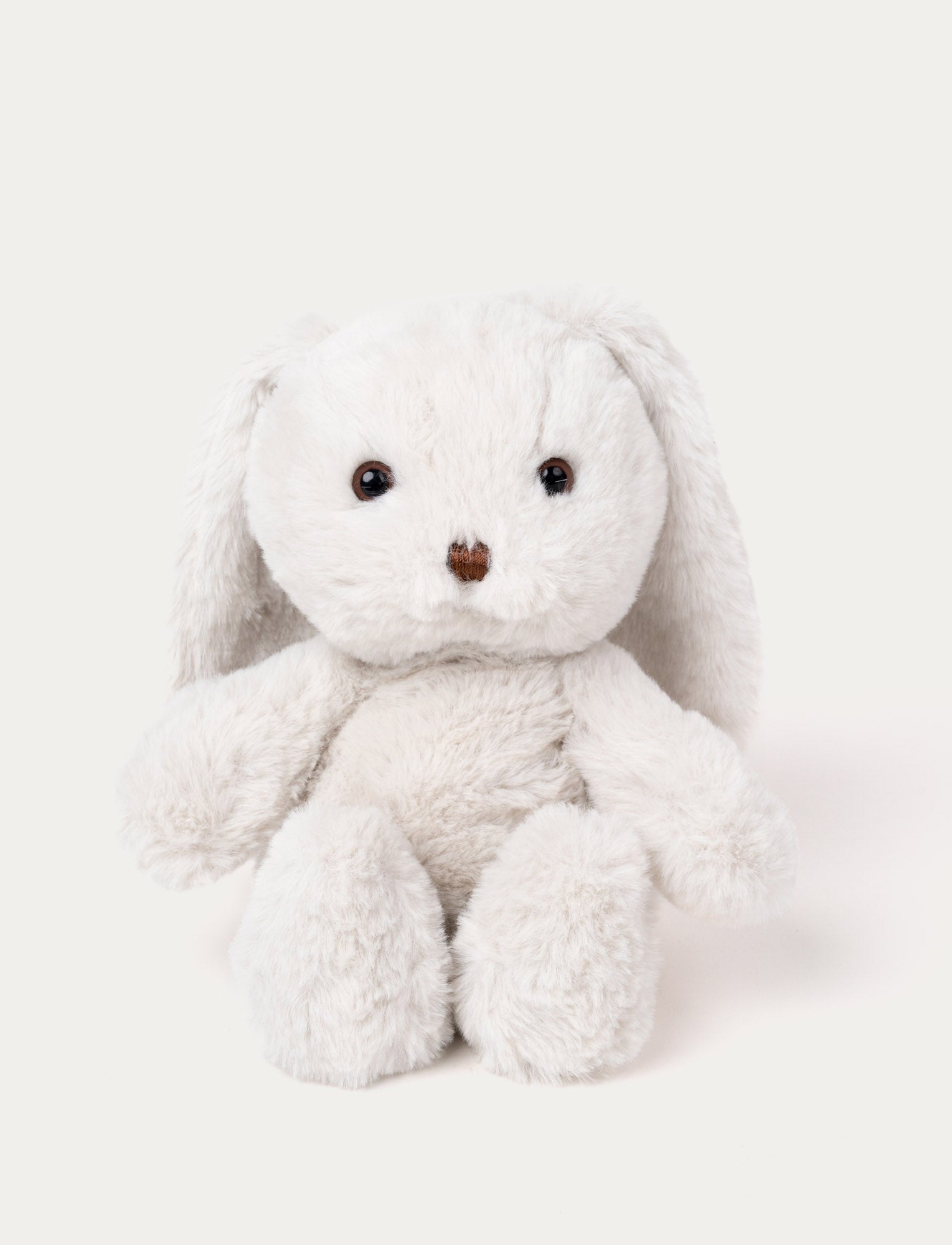  Image of Soft white plush bunny with long floppy ears, brown eyes, and a stitched brown nose.