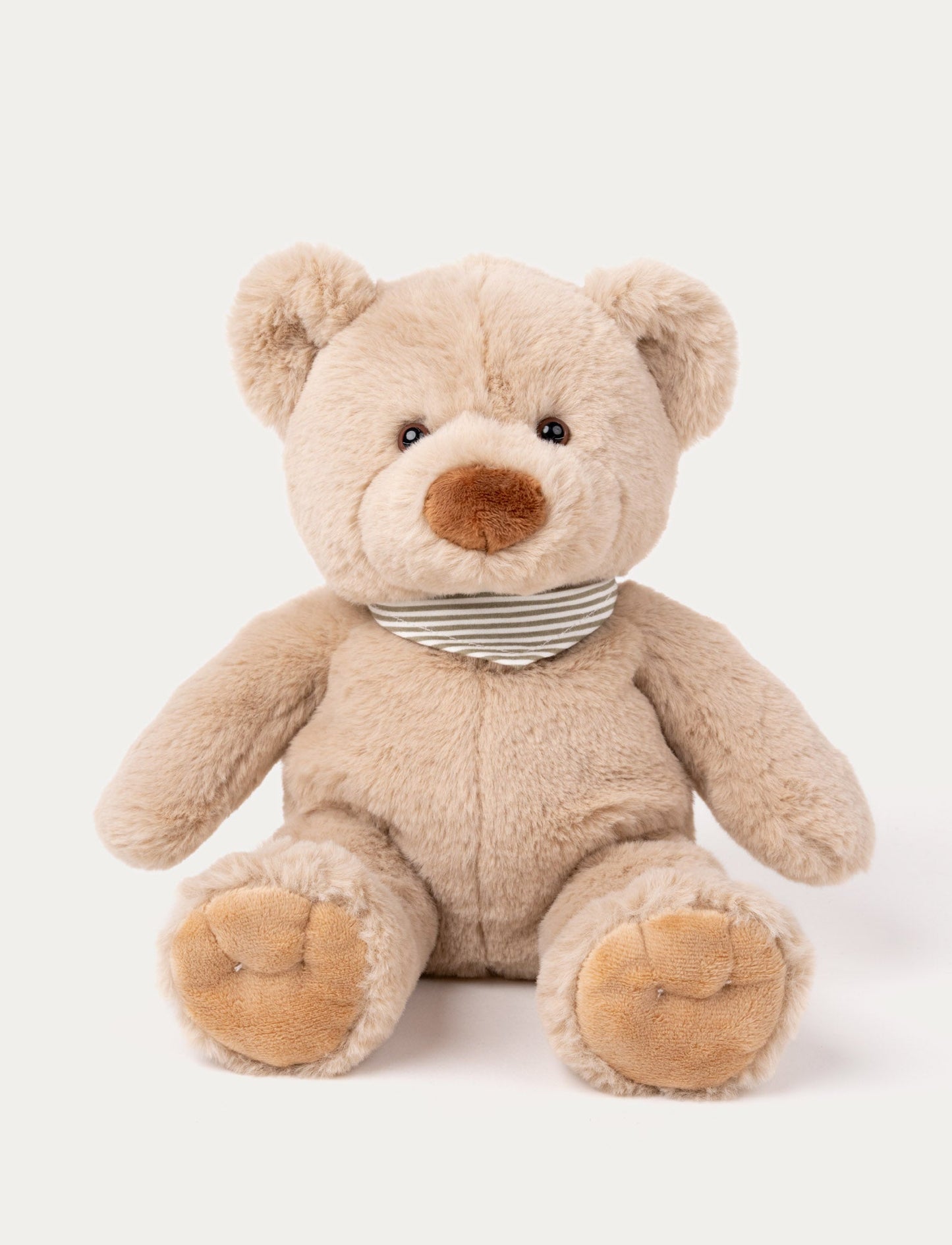 Soft beige teddy bear with a brown nose, black eyes, and a striped gray and white scarf around its neck.