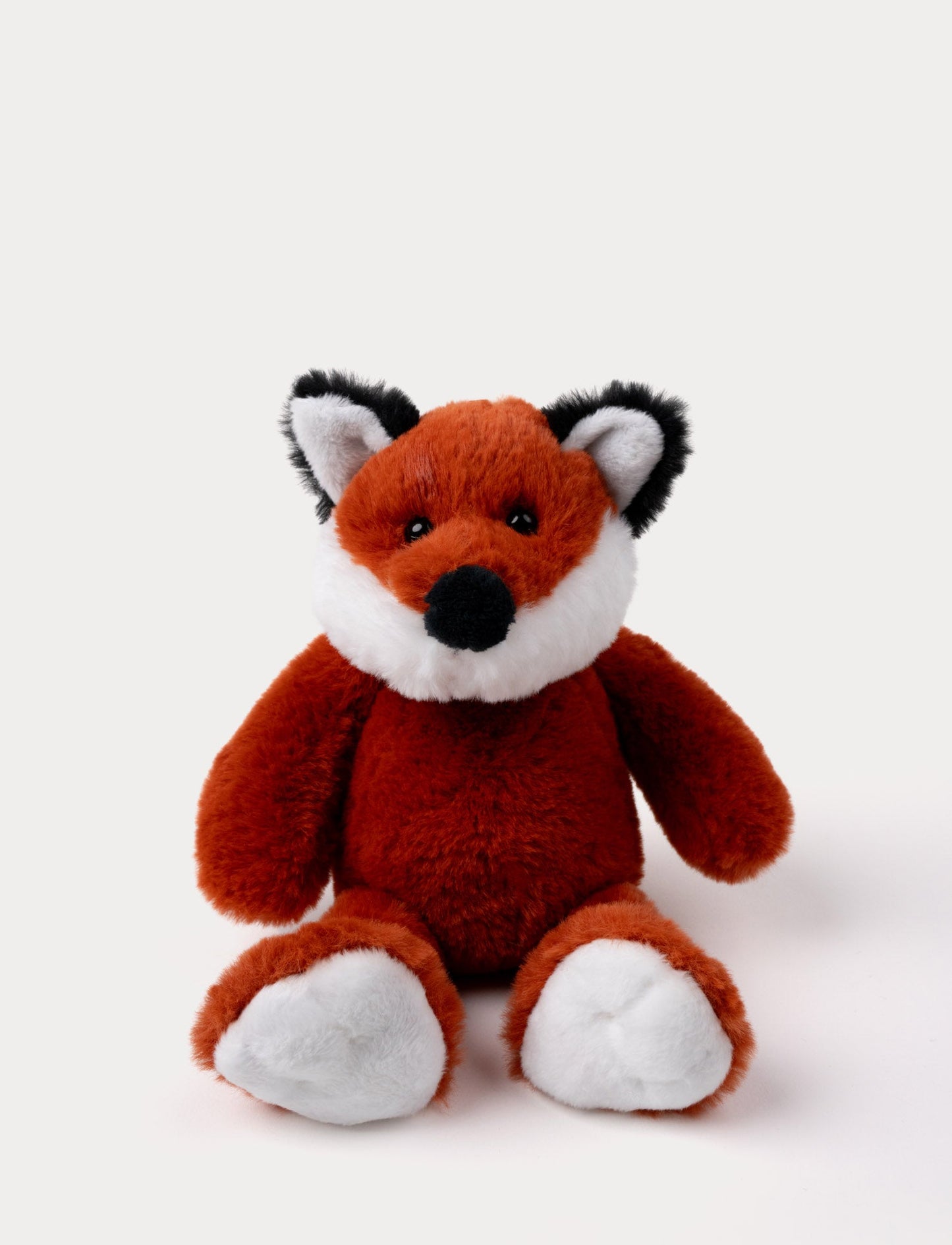 Soft red fox plush with a white belly, black-tipped ears, and shiny black eyes.