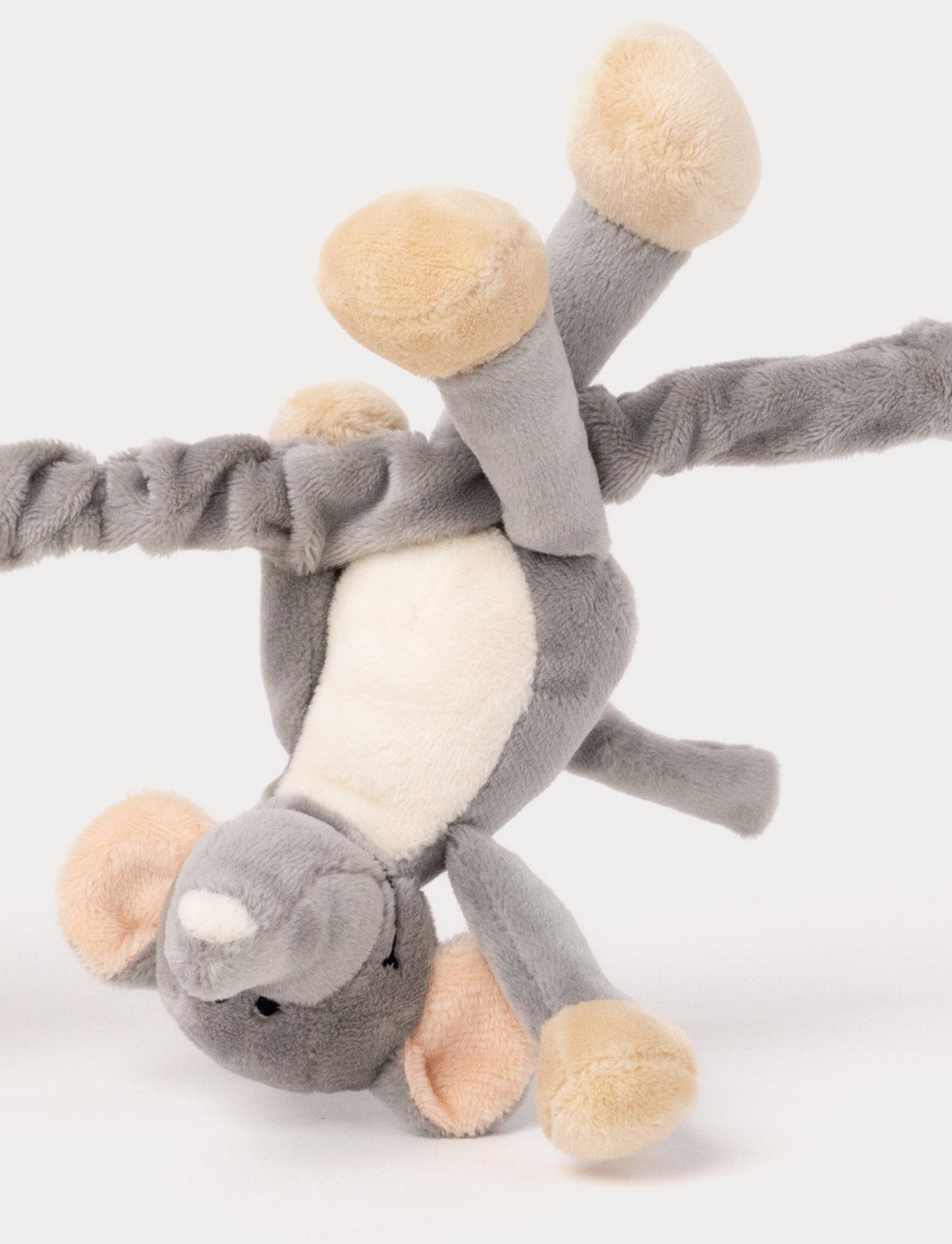 A soft stroller toy featuring a plush elephant and giraffe, white and brown details