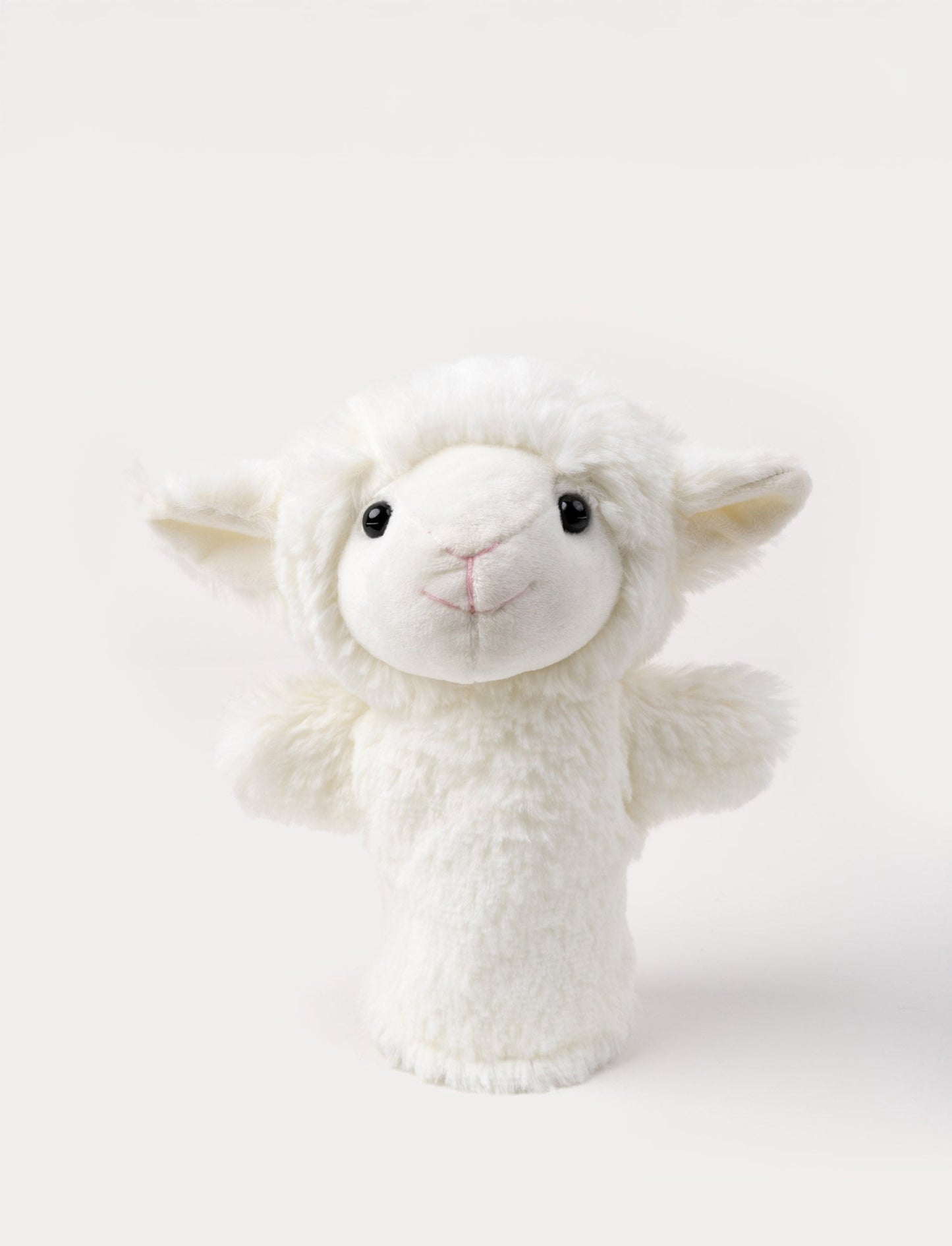 Soft white lamb hand puppet with fluffy ears, a stitched smile, and shiny black eyes.