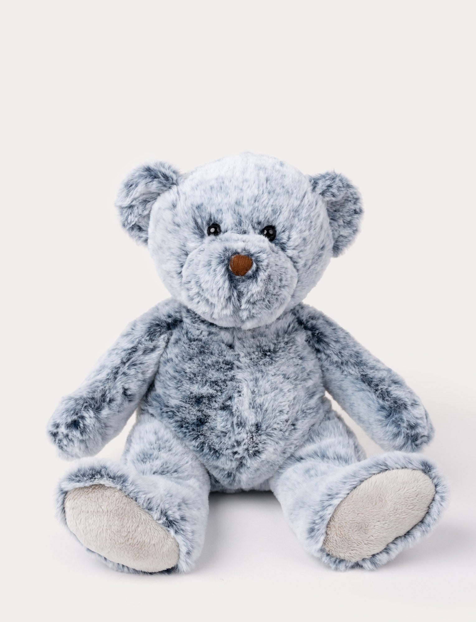  Image of Soft, plush teddy bear with mottled blue fur, black button eyes, a brown nose, and beige paw pads.