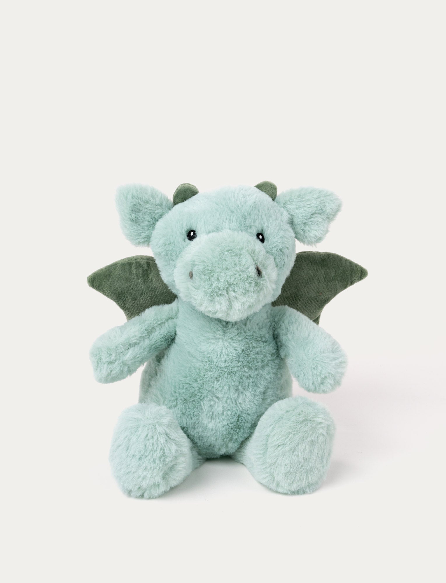  Image of Soft, plush dino in light green with darker green wings and horns, black button eyes, and a friendly expression.