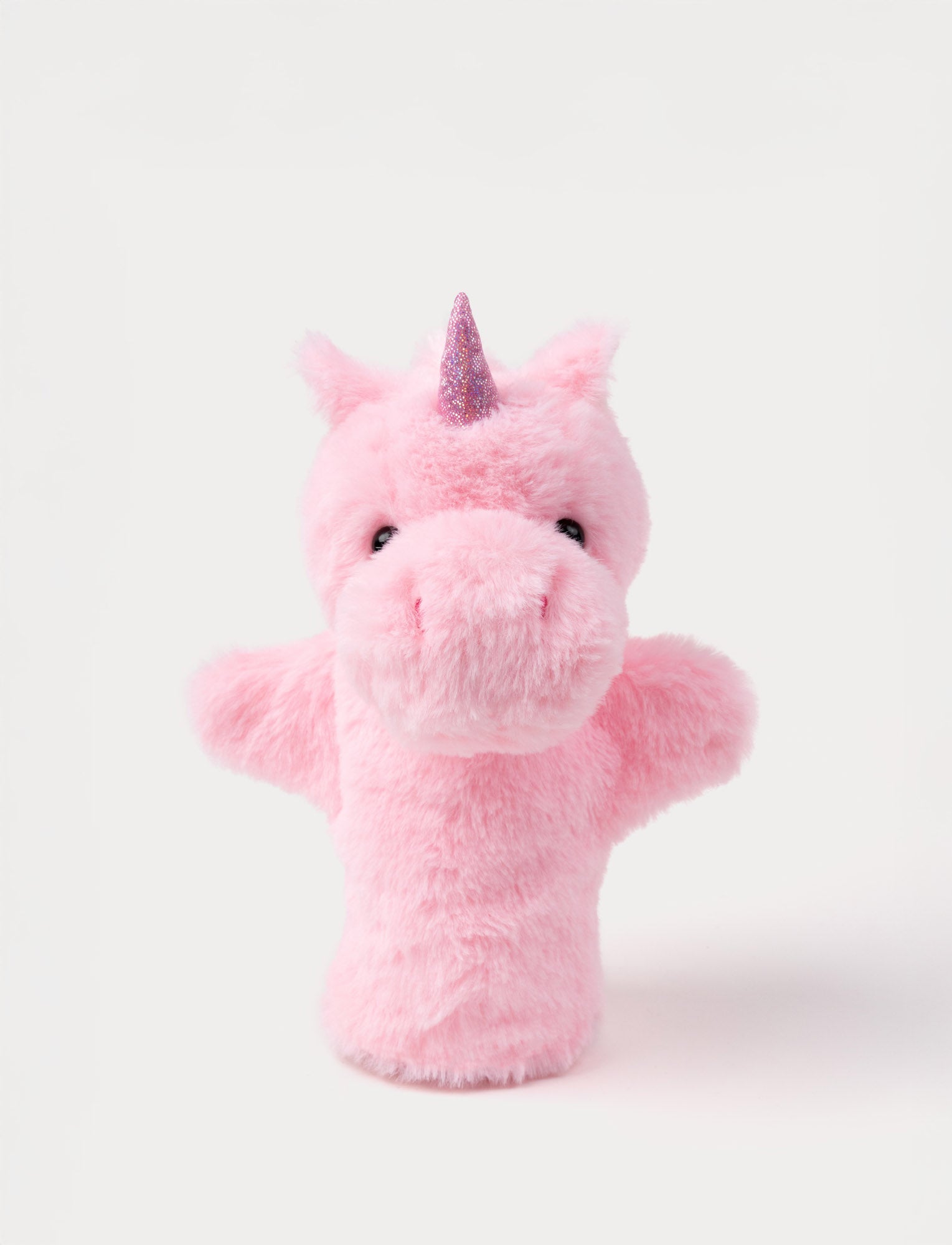  Image of Soft pink unicorn hand puppet with a glittery horn, small ears, and shiny black eyes.