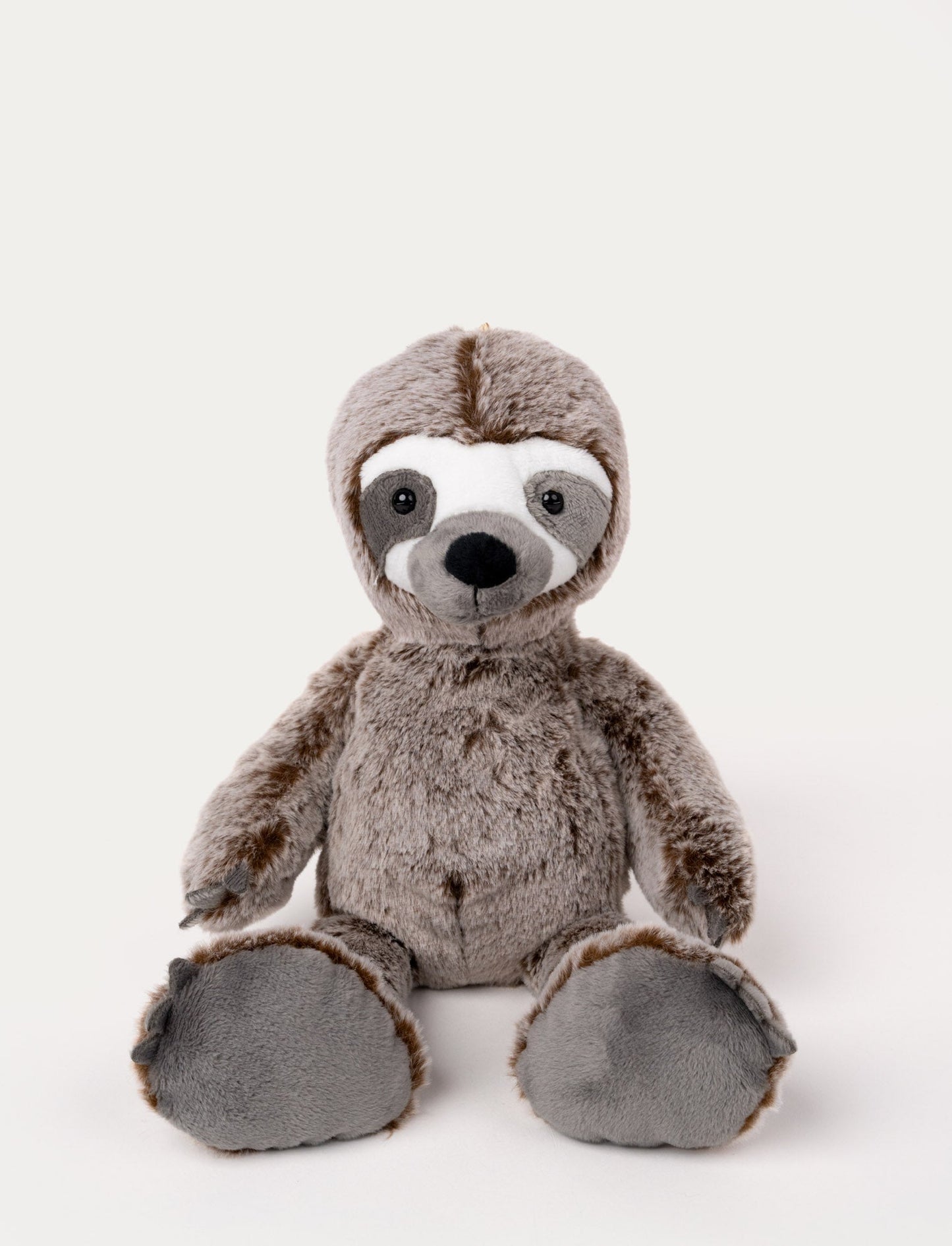 Soft, plush sloth with brown fur, a white face with grey markings, black button eyes, and large padded feet.