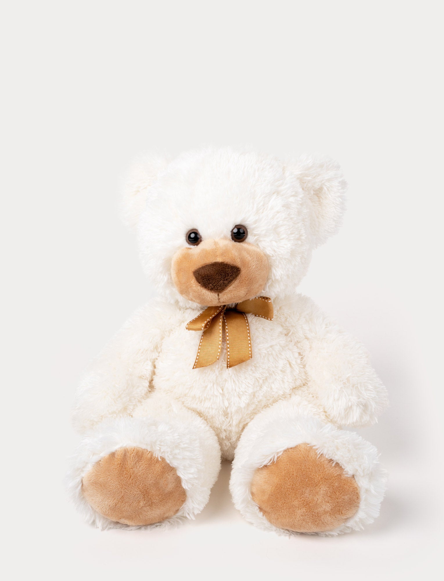 Image of Soft, plush teddy bear with fluffy white fur, brown paw pads, a stitched nose, and a golden ribbon around its neck.