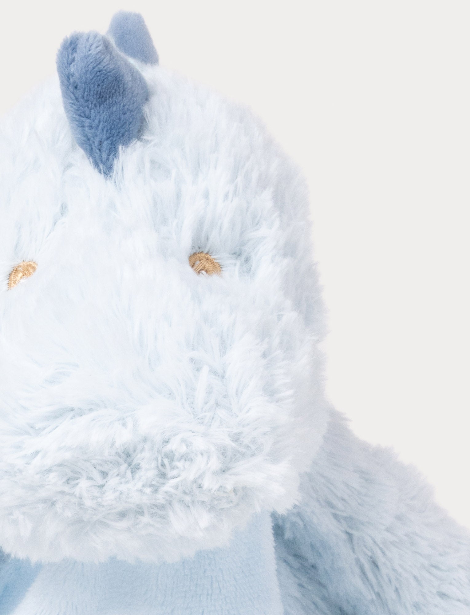  Image of Soft baby blanket with a plush light blue dino head, drak blue spikes, and a cozy fabric body.
