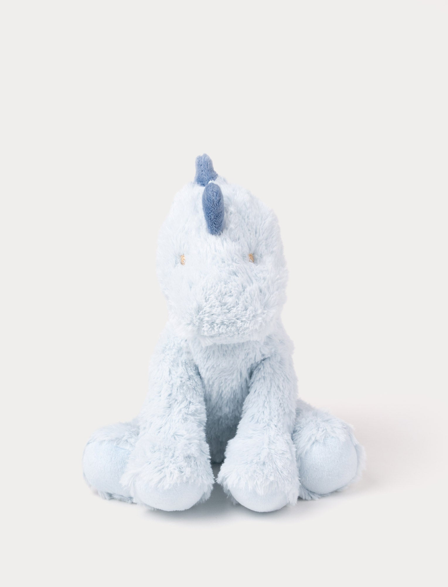  Image of Soft plush light blue dino with dark blue fabric spikes and a fluffy texture.