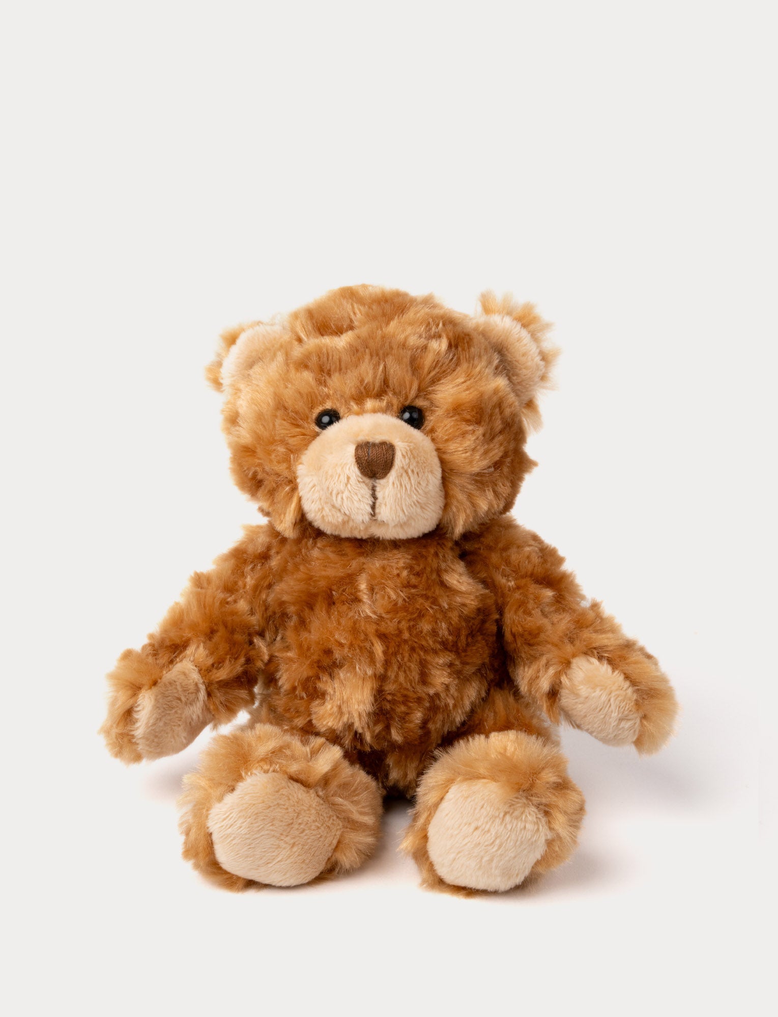  Image of A teddy bear with fluffy brown fur, light brown details, and a cheerful expression.