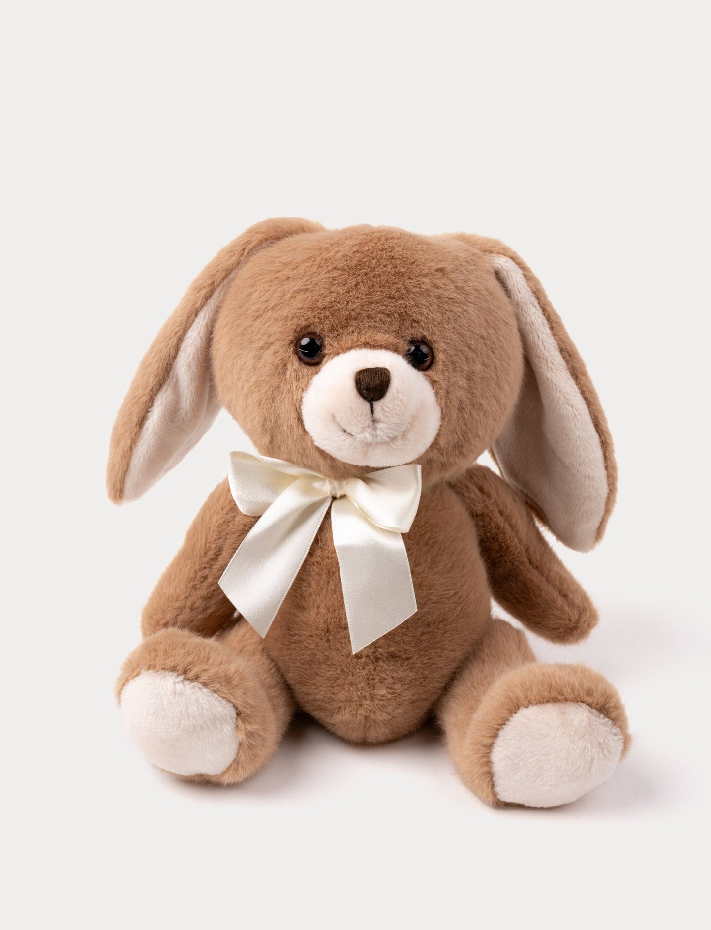A cuddly bunny with soft fur, long ears, and a delicate bow.