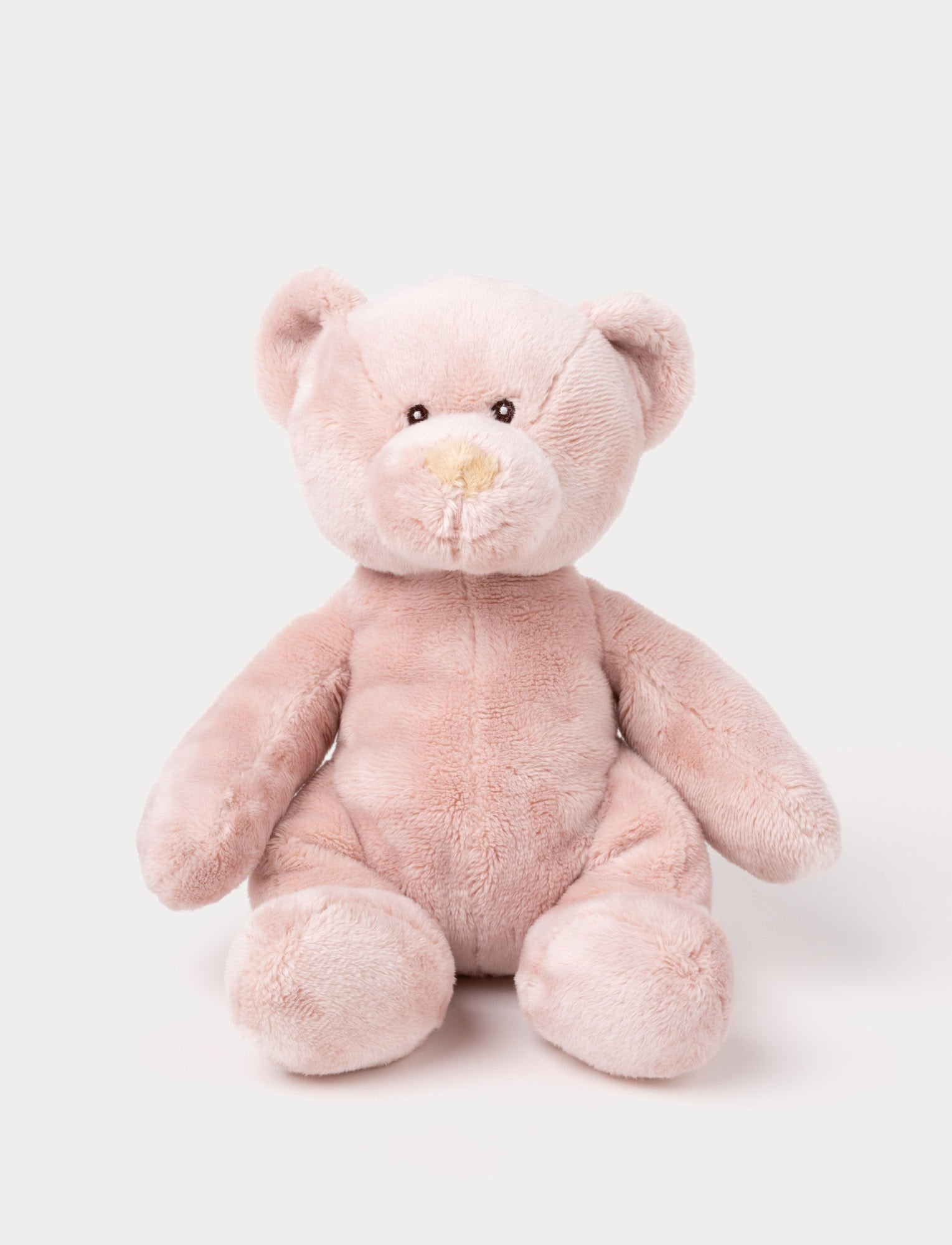  Image of A small teddy bear with short, velvety pink fur and carefully stitched details.