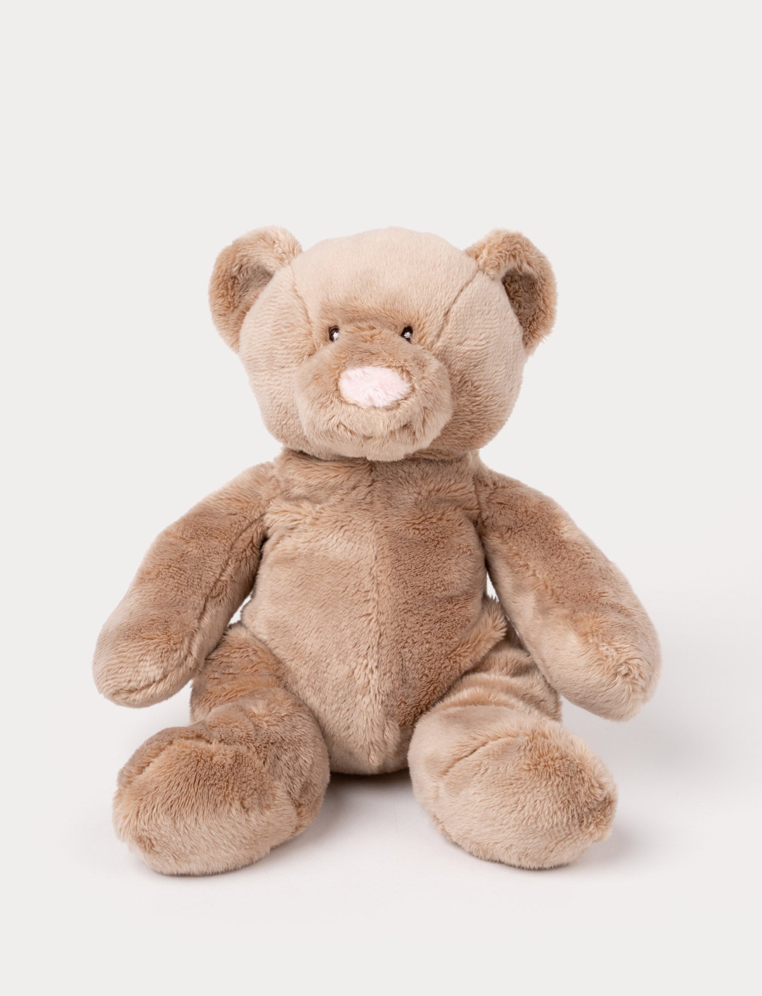  Image of A small teddy bear with short, plush brown fur and carefully stitched details.