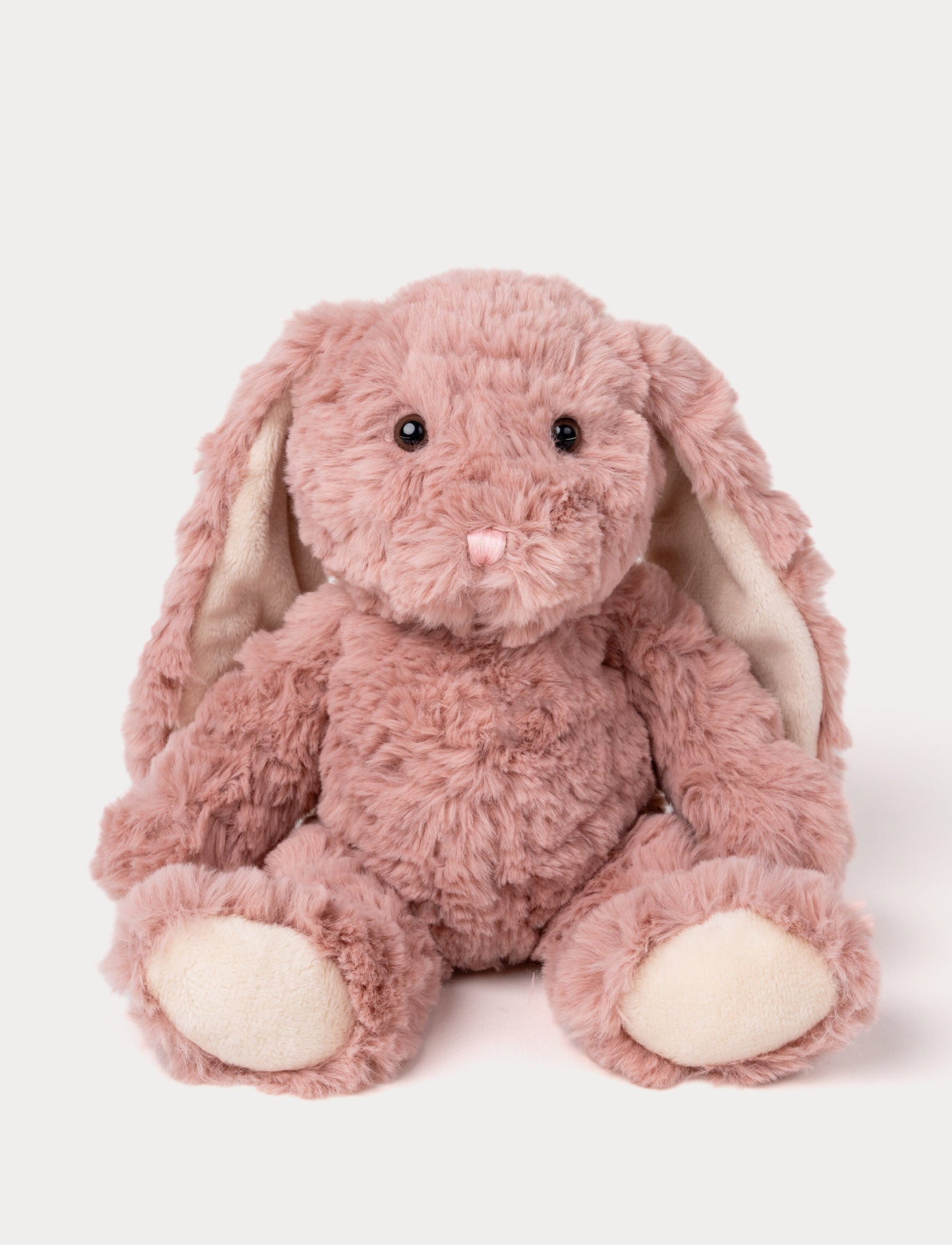  Image of Soft plush bunny with fluffy dusty rose fur, floppy ears, black bead eyes, and a pink stitched nose.