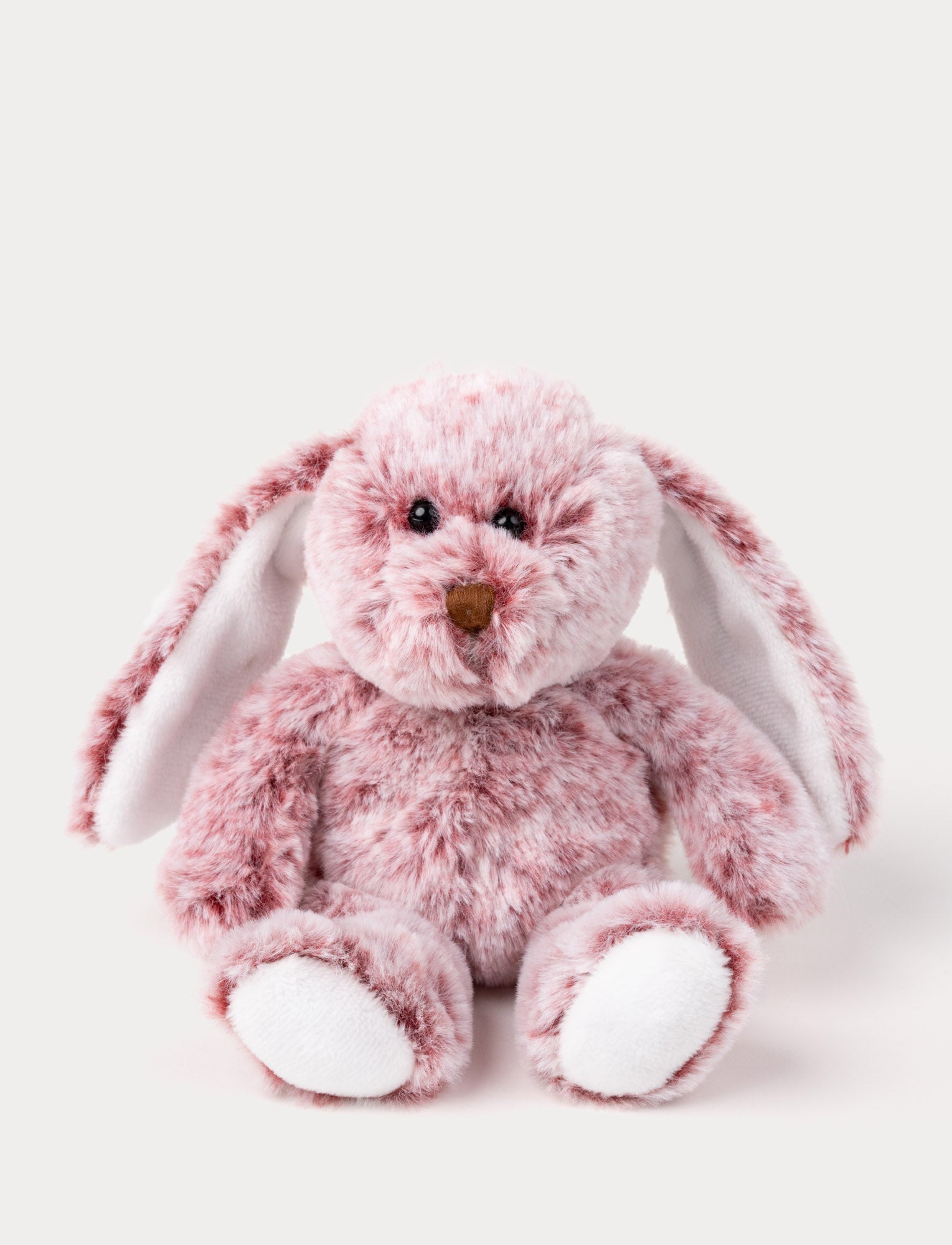  Image of A bunny with soft fur in lingonberry red and creamy white, embroidered nose, and long ears.