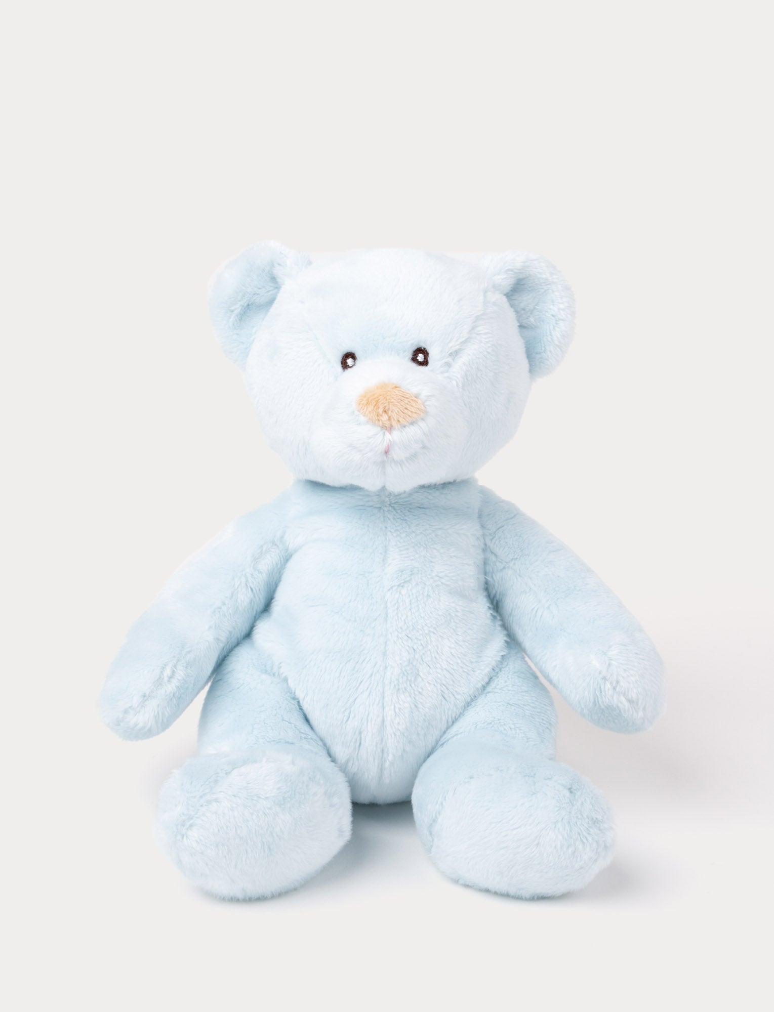  Image of A small teddy bear with short, plush light blue fur and carefully stitched details.