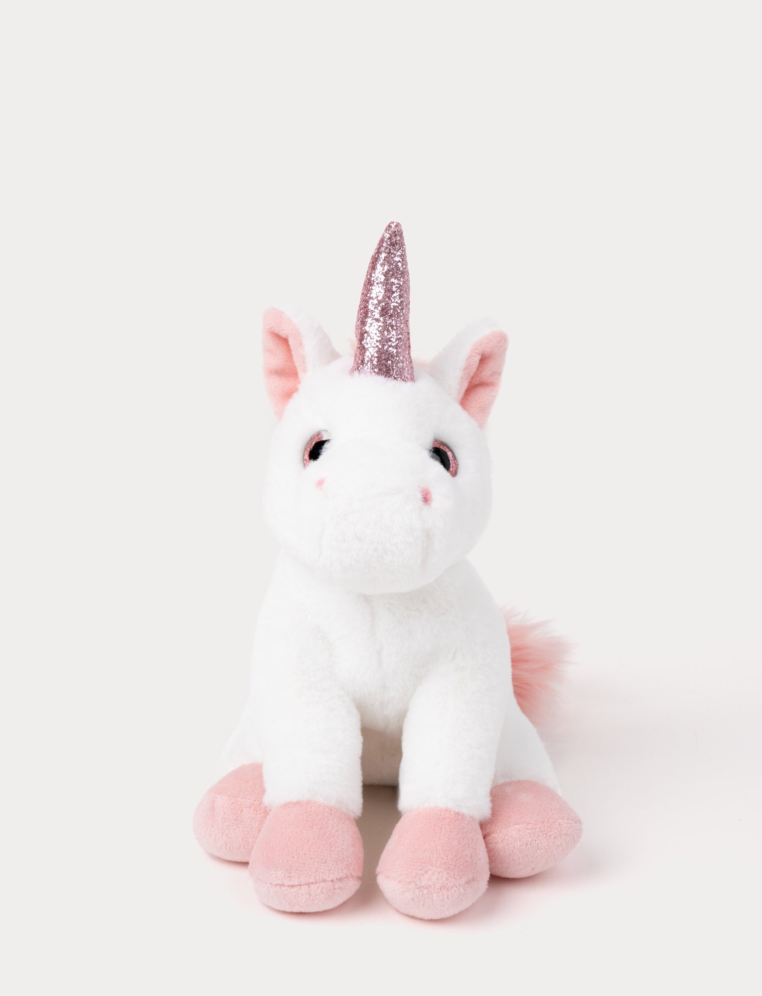  Image of A white unicorn with velvety fur, soft pink details, a sparkling horn, and a fluffy mane and tail.