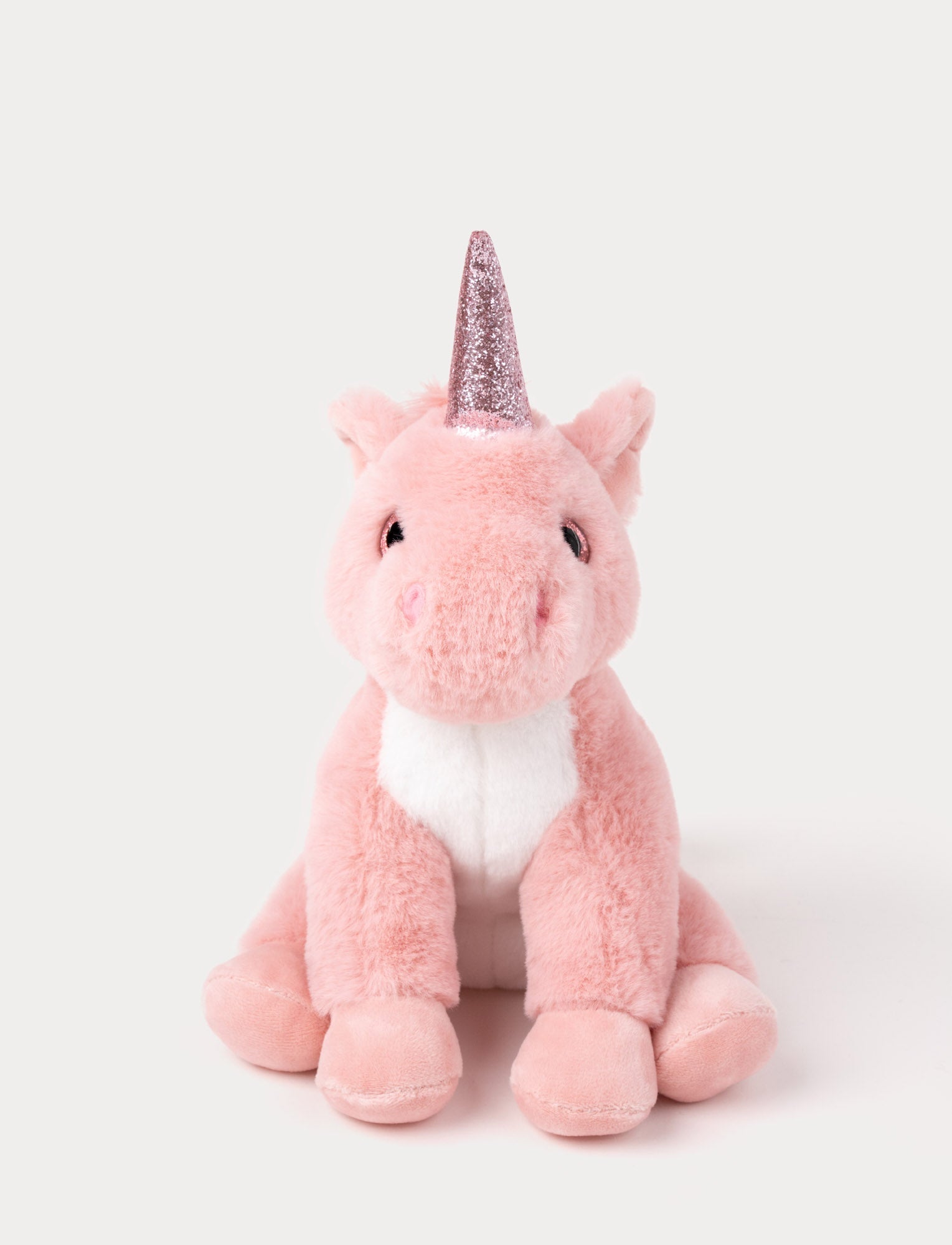  Image of A pink unicorn with velvety fur, a sparkling horn, and a fluffy mane and tail.